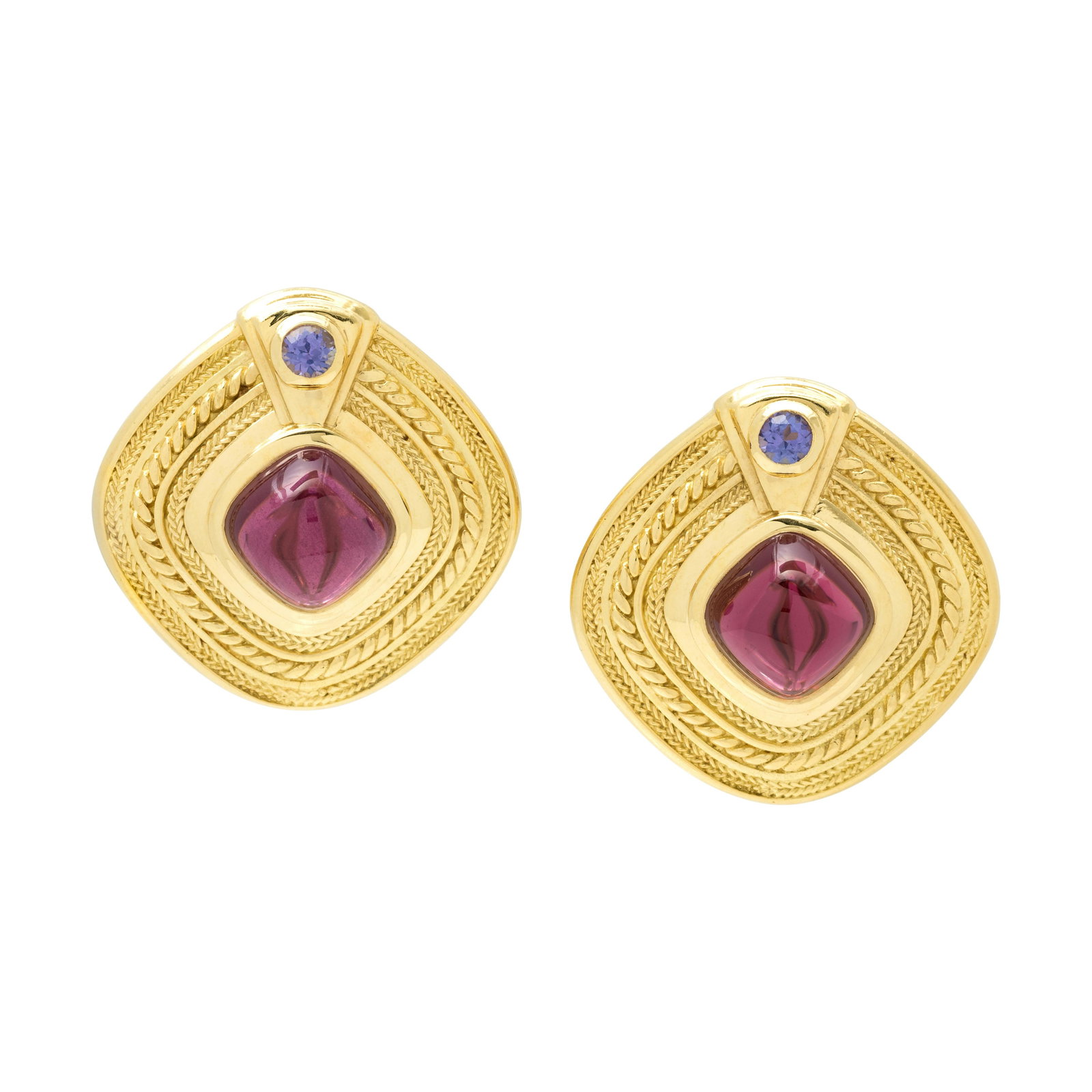 SEIDENGANG, YELLOW GOLD, GARNET AND TANZANITE EARCLIPS: SEIDENGANG, YELLOW GOLD, GARNET AND TANZANITE EARCLIPS Containing two cushion cabochon garnets measuring approximately 10.70 x 10.70 mm and two round mixed cut tanzanite measuring approximately 3.75