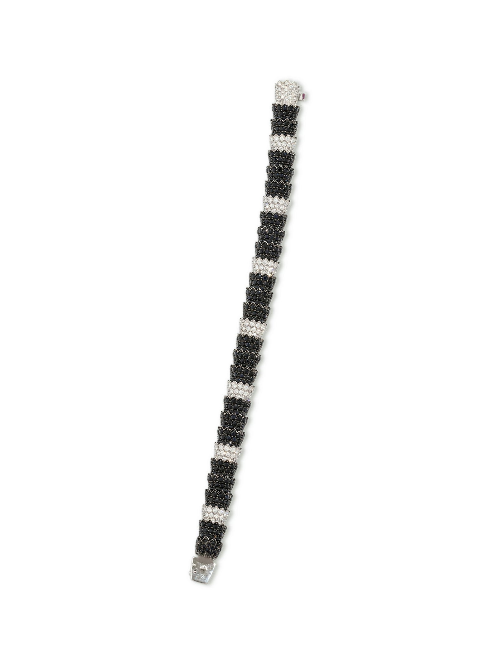 ROBERTO COIN, BLACK SAPPHIRE AND DIAMOND 'COBRA': ROBERTO COIN, BLACK SAPPHIRE AND DIAMOND 'COBRA' BRACELET Consisting of articulated links containing numerous round mixed cut black sapphires measuring approximately 1.50-1.90 mm in diameter and 192 r