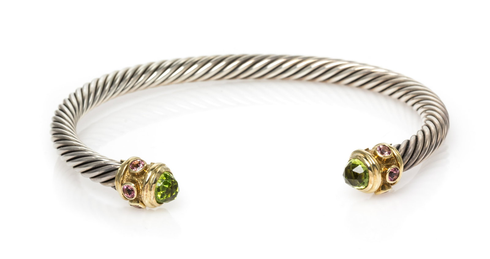 DAVID YURMAN, STERLING SILVER, YELLOW GOLD AND GEMSTONE: DAVID YURMAN, STERLING SILVER, YELLOW GOLD AND GEMSTONE 'RENAISSANCE' CUFF BRACELET Consisting of a cable measuring approximately 5.00 mm wide, the gold finials containing two rose cut peridot and six