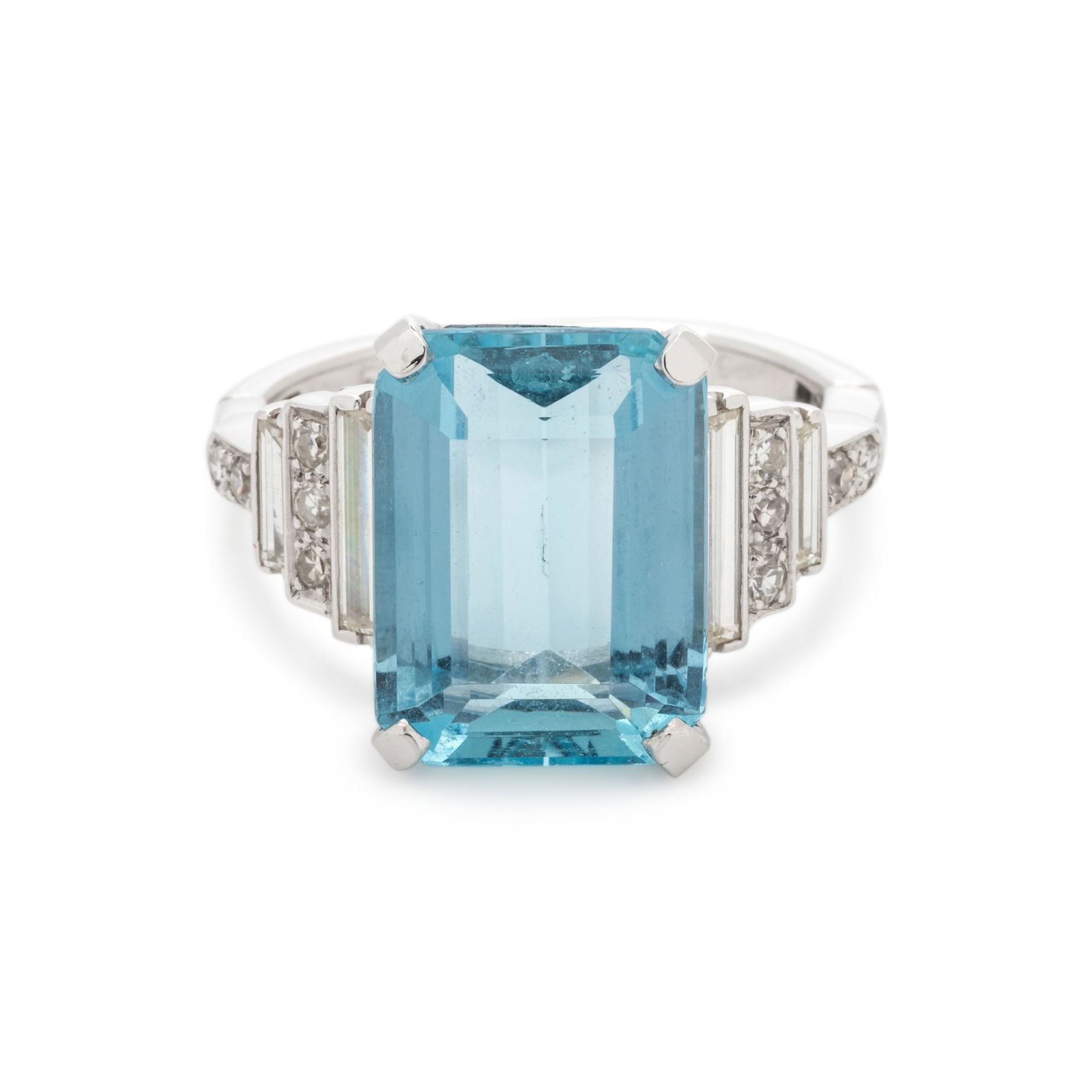 AQUAMARINE AND DIAMOND RING: AQUAMARINE AND DIAMOND RING Containing one emerald cut aquamarine measuring approximately 15.00 x 11.10 x 6.45 mm, four baguette cut diamonds weighing approximately 0.75 carat total and 10 single cut