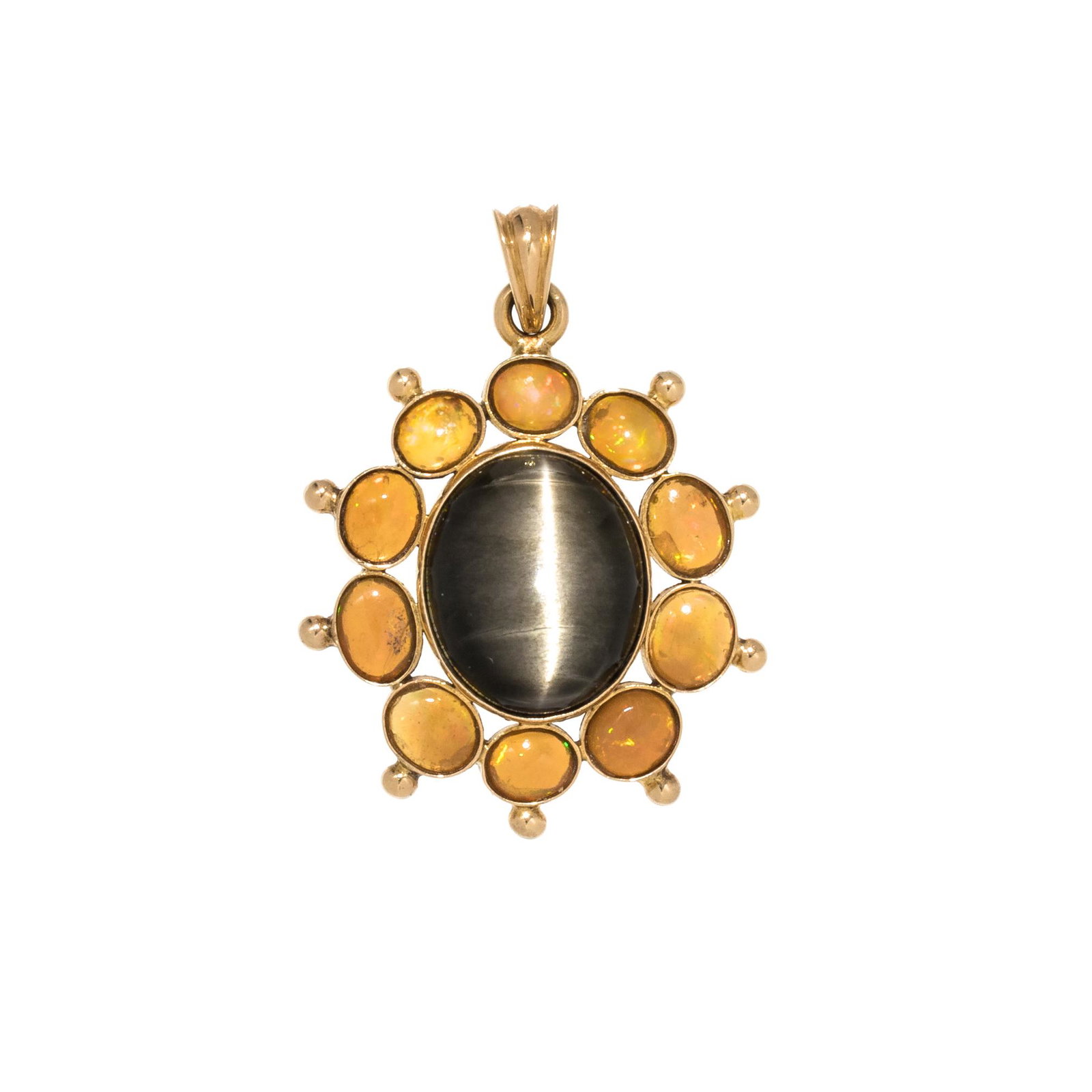 CAT'S EYE QUARTZ AND FIRE OPAL PENDANT: CAT'S EYE QUARTZ AND FIRE OPAL PENDANT Containing one oval cabochon cat's eye quartz measuring approximately 13.80 x 11.55 x 6.15 mm and 10 oval cabochon fire opals measuring approximately 4.50-5.10 x