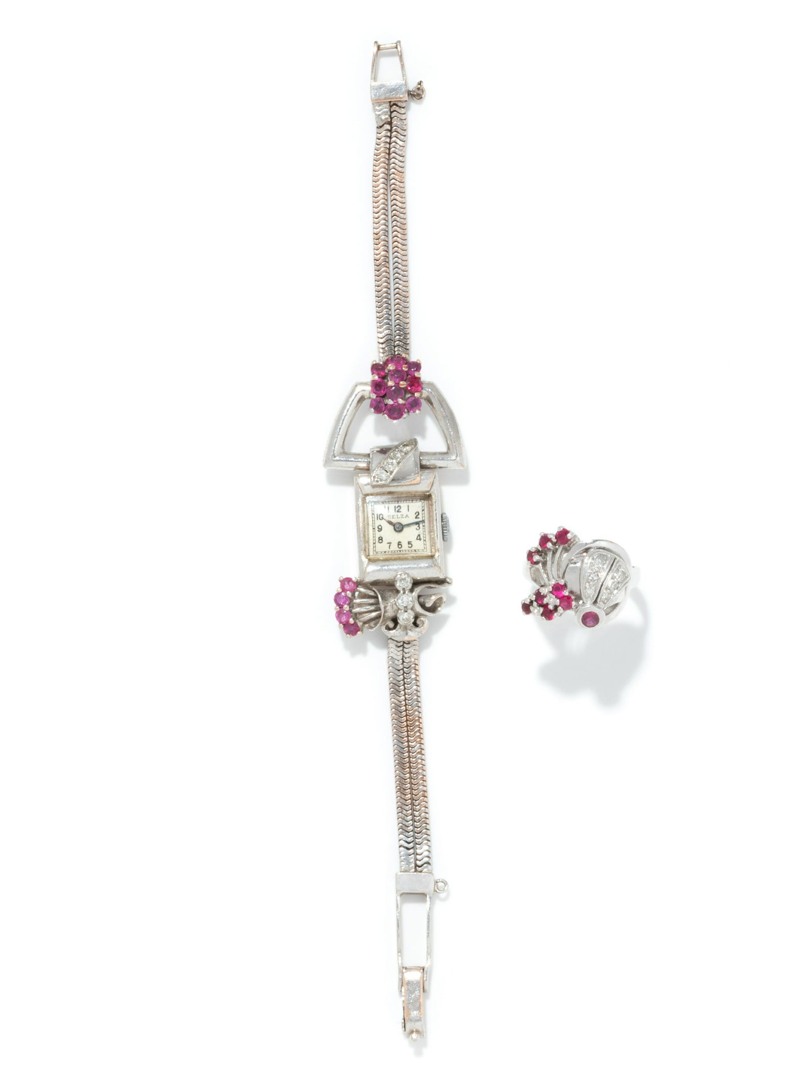 RETRO, COLLECTION OF WHITE GOLD, DIAMOND AND RUBY: RETRO, COLLECTION OF WHITE GOLD, DIAMOND AND RUBY JEWELRY Consisting of a ring containing six single cut diamonds and nine round mixed cut rubies, together with a wristwatch with the lugs containing s