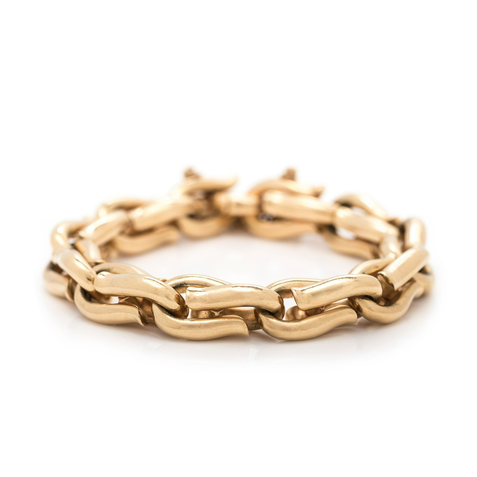 YELLOW GOLD BRACELET: YELLOW GOLD BRACELET Consisting of a stirrup link chain measuring approximately 12.45 mm wide. Stamp: (maker's mark for Fisher & Co.) 14K. 72.45 dwt.