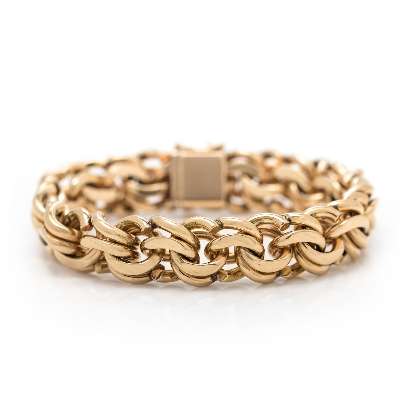 YELLOW GOLD BRACELET: YELLOW GOLD BRACELET Consisting of a fancy link chain measuring approximately 13.30 mm wide. Stamp: SUCCO 14K. 52.80 dwt.