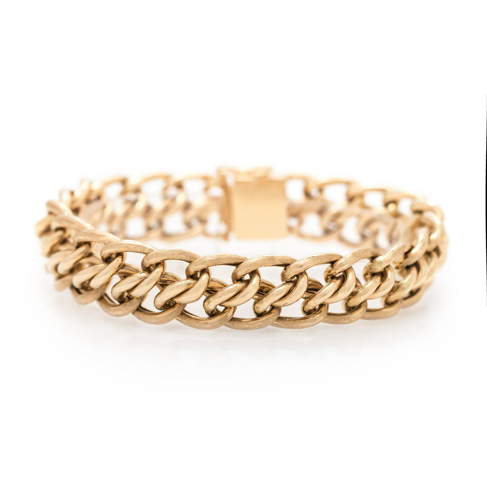 YELLOW GOLD BRACELET: YELLOW GOLD BRACELET Consisting of a double curb link chain with high polish and textured gold finish measuring approximately 13.65 mm wide. Stamp: (maker's mark for Zelman & Friedman) 14K. 24.85 dwt.