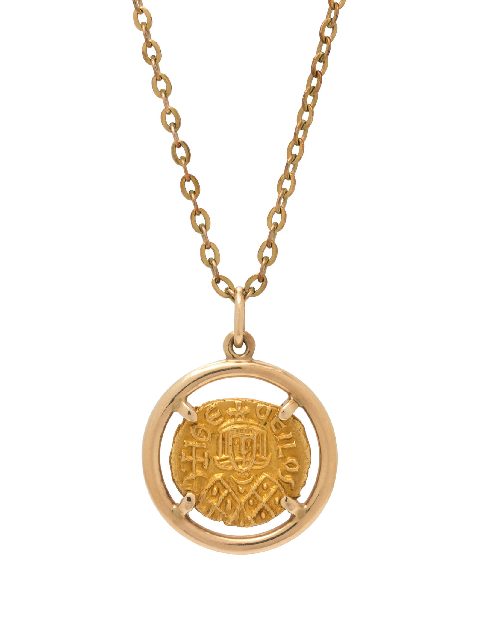 YELLOW GOLD AND BYZANTINE 1 SOLIDUS COIN PENDANT: YELLOW GOLD AND BYZANTINE 1 SOLIDUS COIN PENDANT Consisting of a yellow gold pendant containing one Byzantine 1 Solidus Theophilus coin, 9th Century A.D., together with a gold-filled chain. Clasp stam