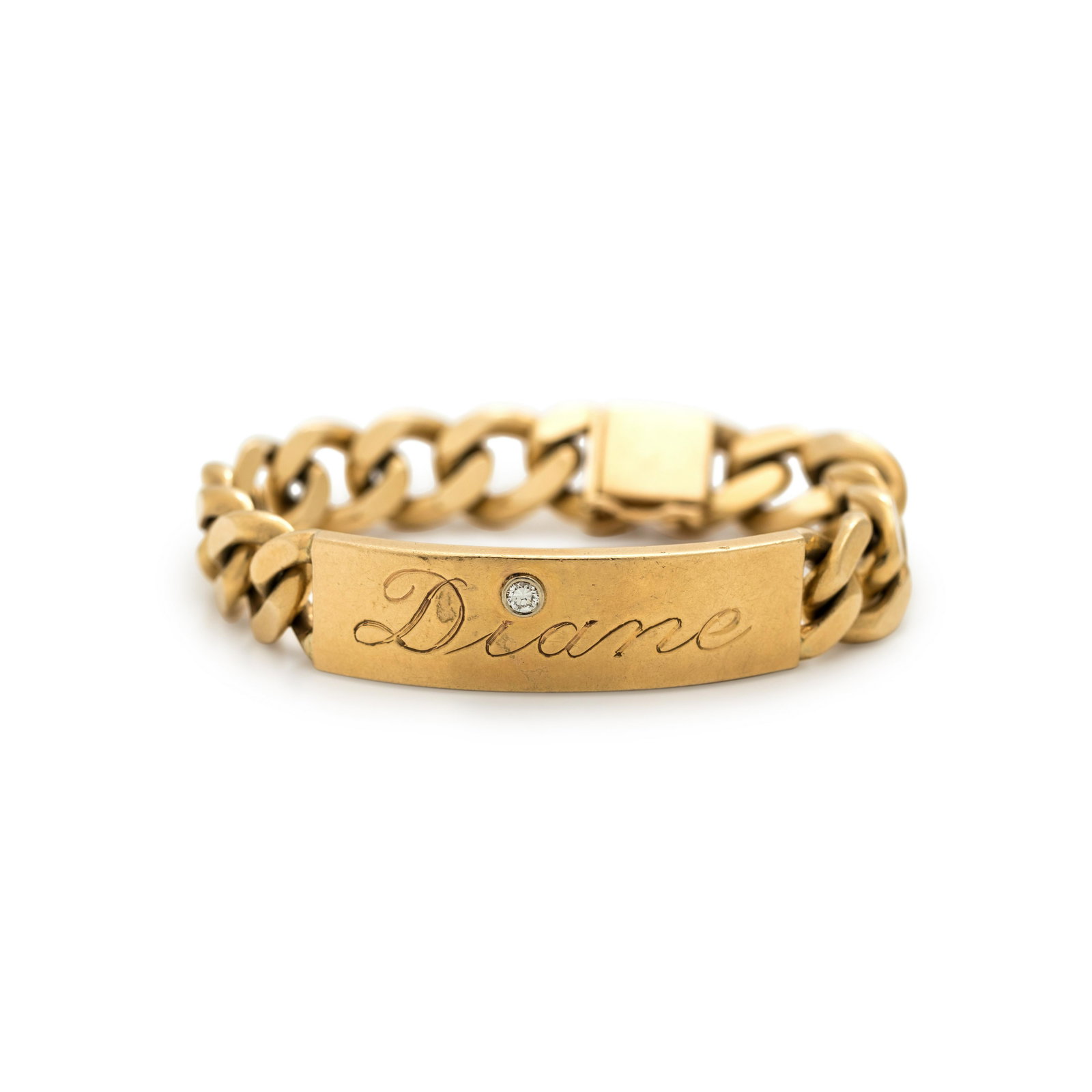 YELLOW GOLD AND DIAMOND ID TAG BRACELET: YELLOW GOLD AND DIAMOND ID TAG BRACELET Consisting of a curb link chain and curved plaque with 'Diane' engraving containing one round brilliant cut diamond weighing approximately 0.12 carat. Stamp: (m