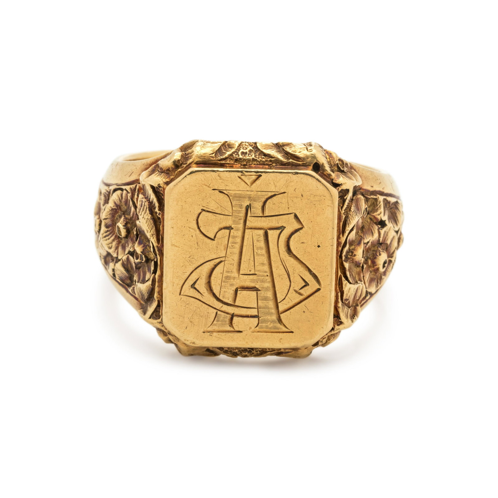 YELLOW GOLD RING: YELLOW GOLD RING Consisting of a monogram engraved signet ring with floral engraved detail. Stamp: (Hungarian hallmark) S. 19.40 dwt. The Estate of Stephen Adler, London, England