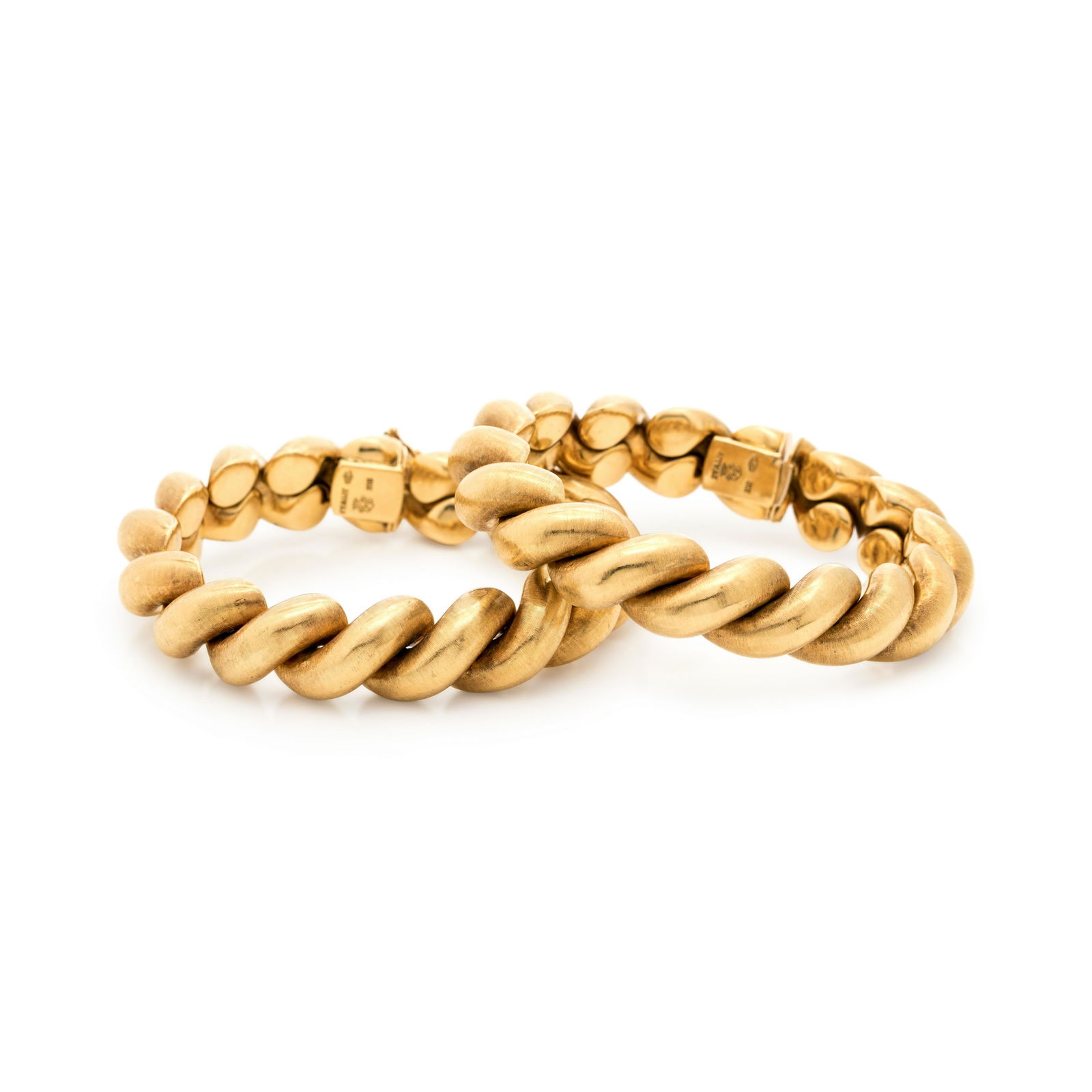 PAIR OF YELLOW GOLD BRACELETS: PAIR OF YELLOW GOLD BRACELETS Consisting of two San Marco link bracelets in a Florentine finish, measuring approximately 14.20 mm wide. Stamp: ITALY (Italian hallmark) (maker's mark) K18. 70.70 dwt. P