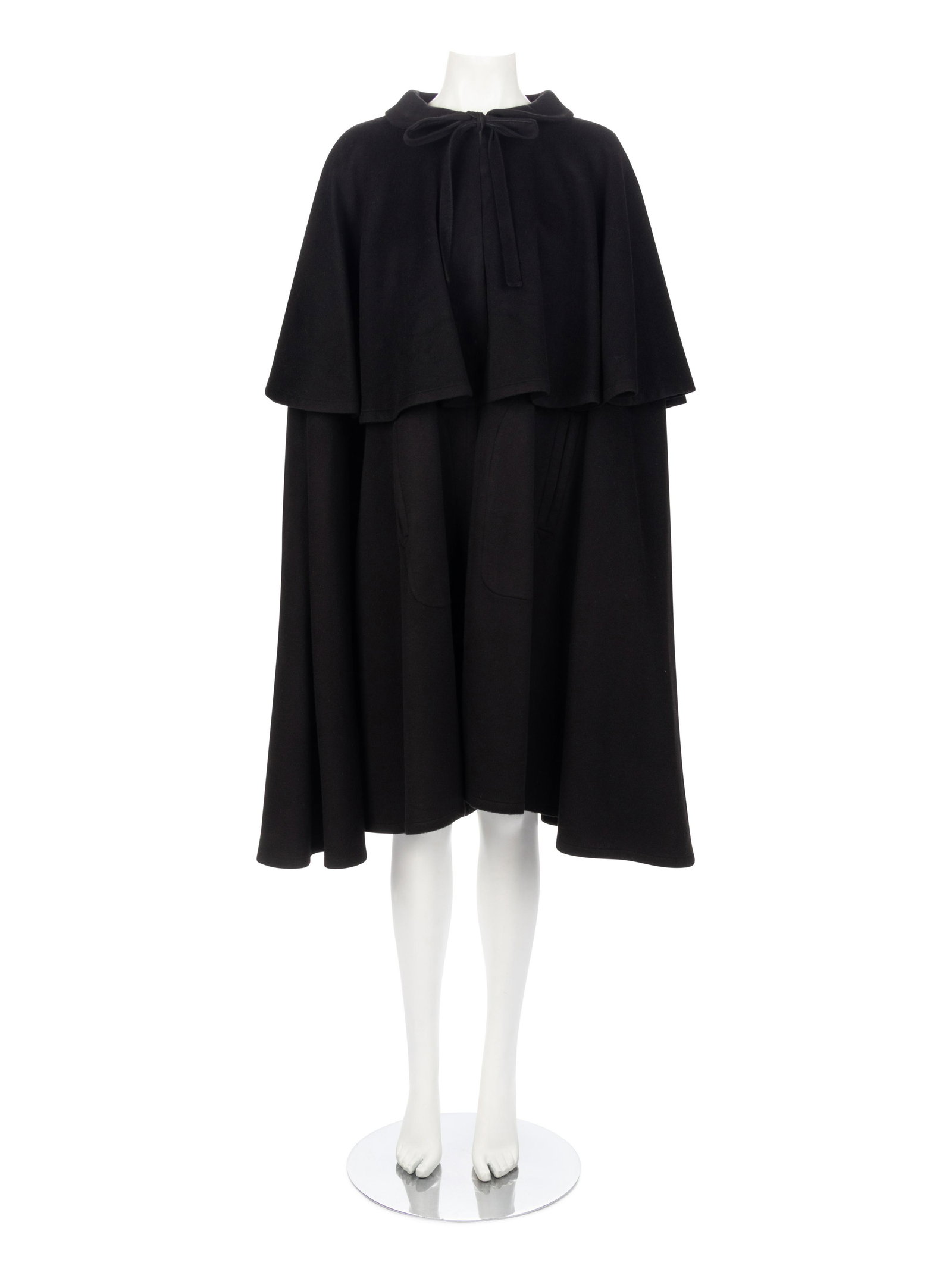 Yves Saint Laurent Rive Gauche Black Cape, 1980-90s: Yves Saint Laurent Rive Gauche Black Cape, 1980-90s Black cashmere blend tiered cape with Peter Pan collar and tied neck closure.† Label: Yves Saint Laurent / Rive Gauche Approximate Measurement