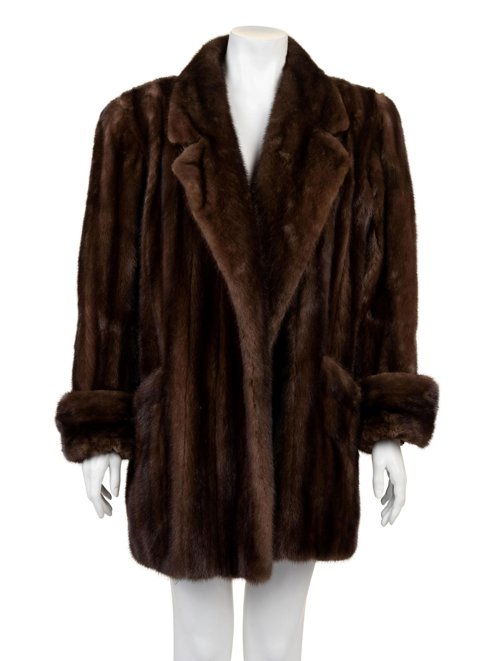 Yves Saint Laurent Mink Coat, 1980s: Yves Saint Laurent Mink Coat, 1980s Brown mink clutch coat with notched lapels, long cuffed sleeves and a center front without closures. The points on the collar have bendable boning in them for shapi