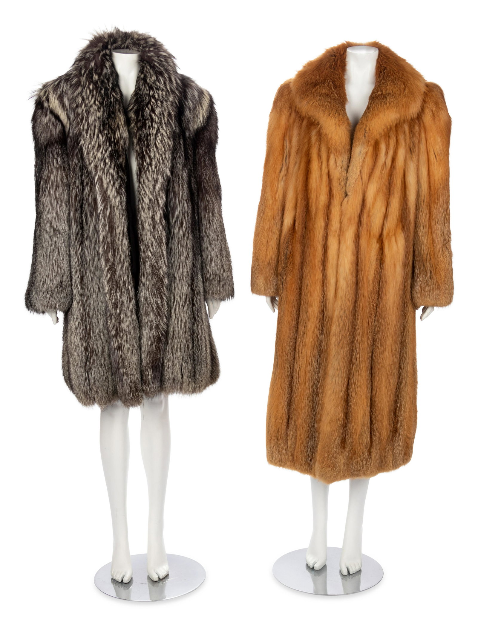 Two Fox Fur Coats, 1980-2000s: Two Fox Fur Coats, 1980-2000s This lot includes two fur coats.† THE FIRST Dark brown and gray fox fur clutch coat with shawl collar and long straight sleeves. "D A M" is monogrammed on the front