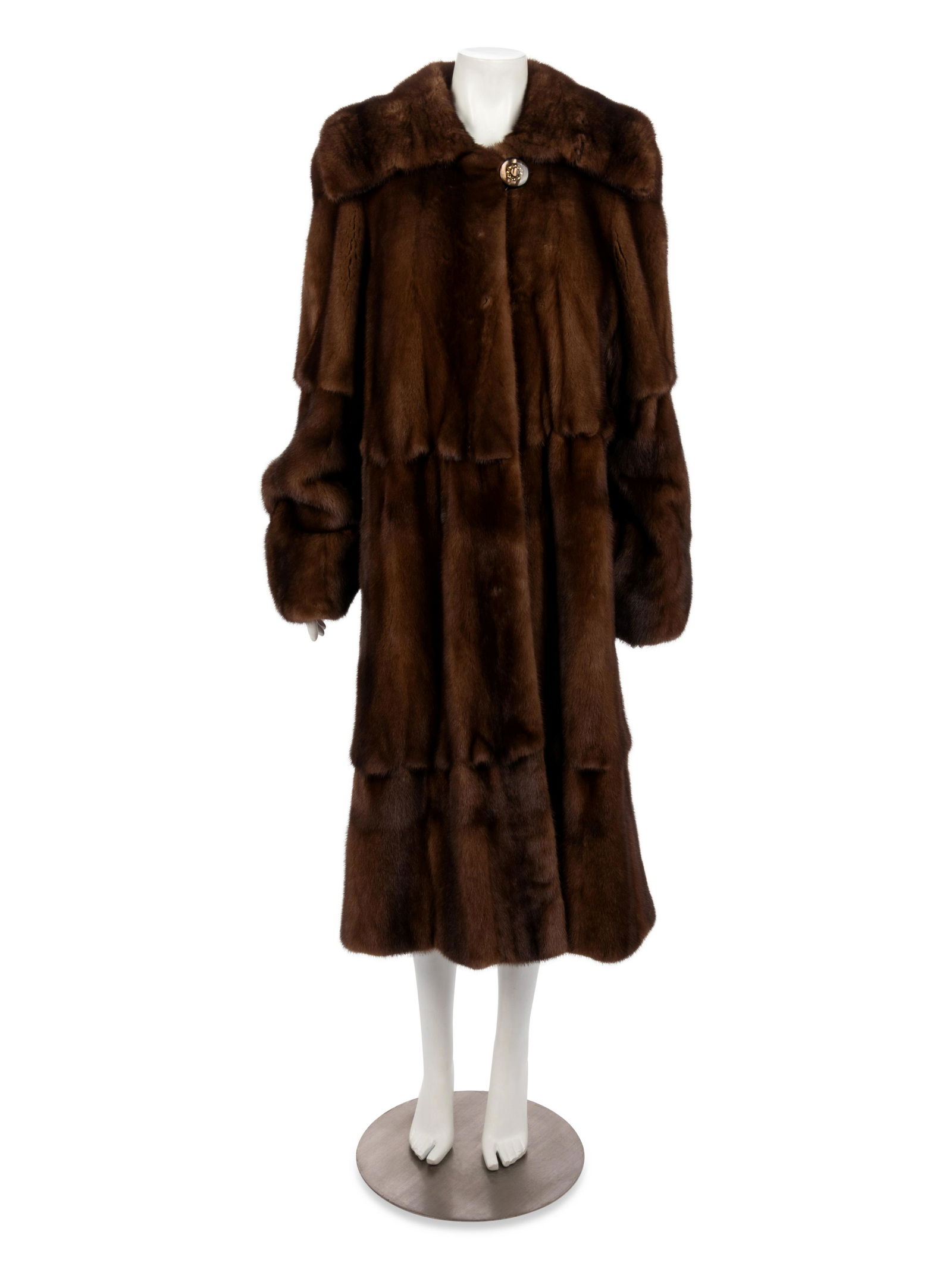 Birger Christensen Mink Fur Coat, 1990-2000s: Birger Christensen Mink Fur Coat, 1990-2000s Brown mink fur tiered coat with exaggerated roll collar, flared sleeves, front hip pockets, and center front hook clasp closures. 'ENA' is monogrammed on t