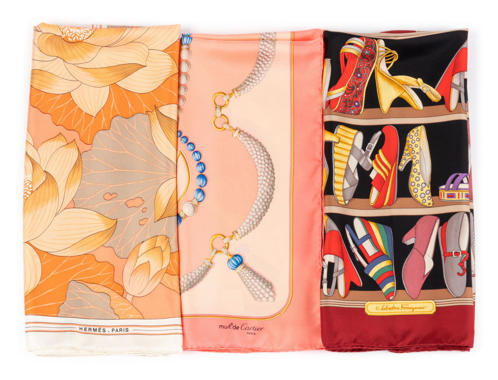 Three Designer Scarves; One Hermes, One Ferragamo, One: Three Designer Scarves; One Hermes, One Ferragamo, One Cartier, 1980-2000s This lot includes three scarves.† THE FIRST "Fleurs de Lotus" pattern by Christiane Vauzelles. Year of issue, 1976.R