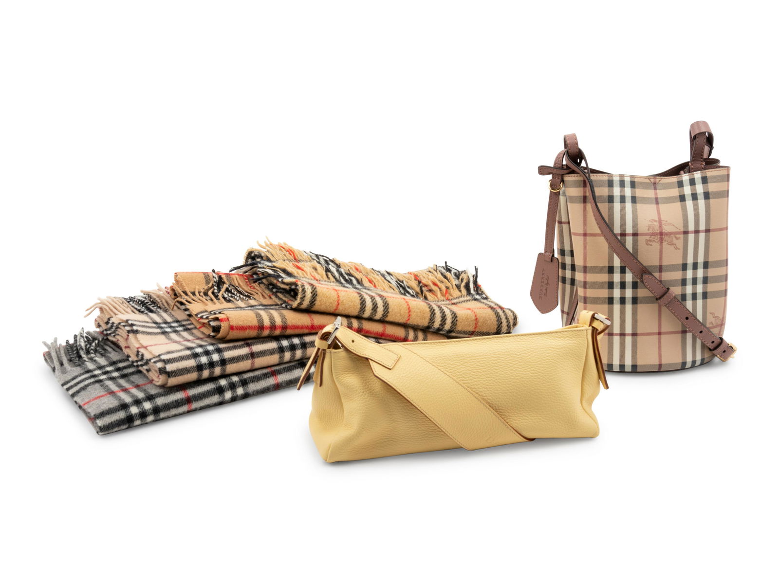 Collection of Six Burberry Items; Four Scarves, Two: Collection of Six Burberry Items; Four Scarves, Two Bags, 1990-2000s This lot includes six items; four scarves and two bags.† THE FIRST Gray Burberry tartan plaid lambswool scarf with fringe. La