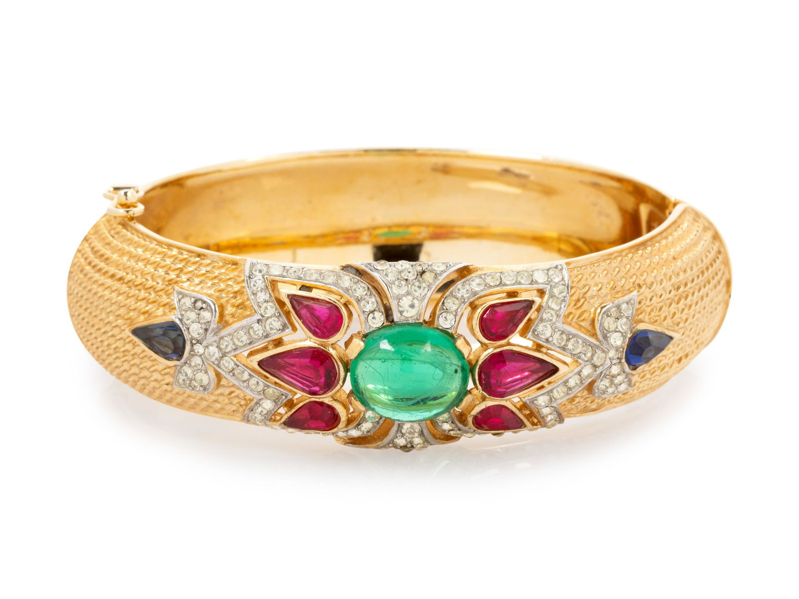 Four Pieces of Vintage Costume Jewelry; Three Trifari,: Four Pieces of Vintage Costume Jewelry; Three Trifari, One Schiaparelli, 1980-90s This lot includes four jewelry† pieces. THE FIRST Gold-tone clamp bracelet with center green cabochon with red,