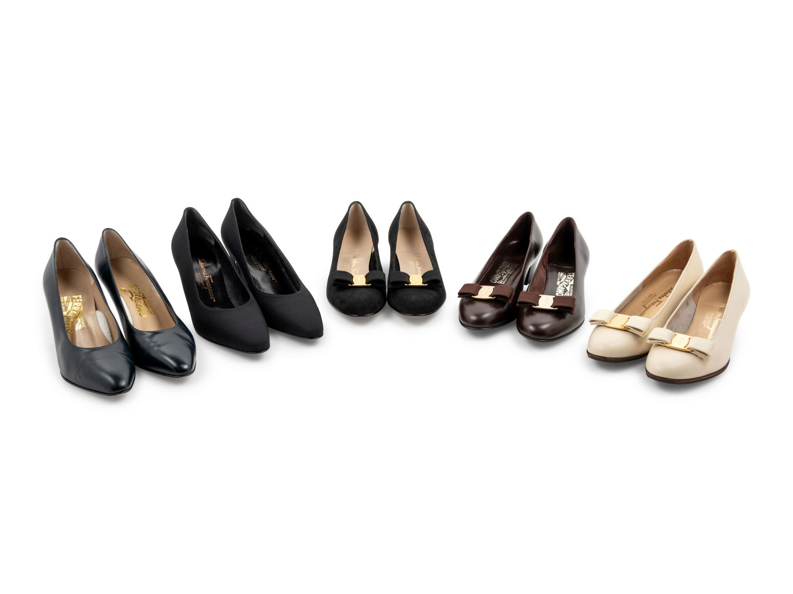 Nine Pairs of Salvatore Ferragamo Shoes, 1990-2010s: Nine Pairs of Salvatore Ferragamo Shoes, 1990-2010s This lot includes nine pairs of shoes.† THE FIRST White leather slip on pumps with Vara bow accent, almond-toe silhouette, and leather lining