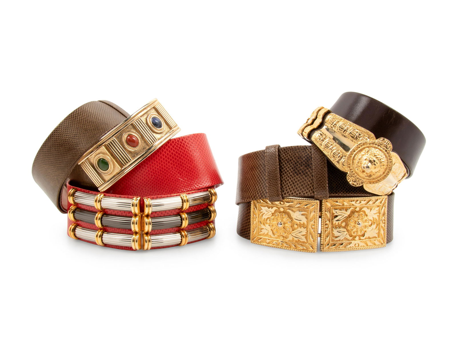 Four Judith Leiber Belts: Four Judith Leiber Belts This lot includes four belts.† THE FIRST Brown metallic finish Karung snake skin adjustable belt with gold-tone buckle set with green, blue, and red stones. Comes with a