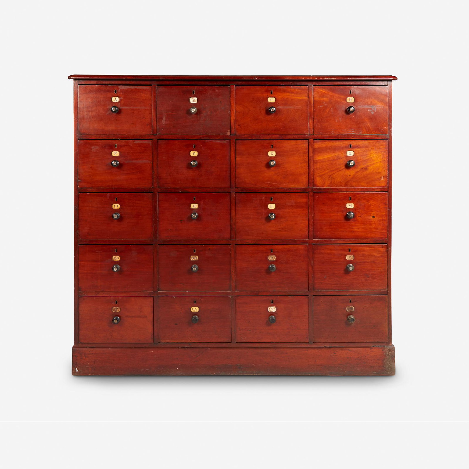Victorian mahogany twenty-drawer alphabetized cabinet,: Victorian mahogany twenty-drawer alphabetized cabinet 19th century Each drawer with carved inset bone labels; in two parts, composed of an upper section on separate base.H: 55 1/2 in. W: 21 in. L: 57 