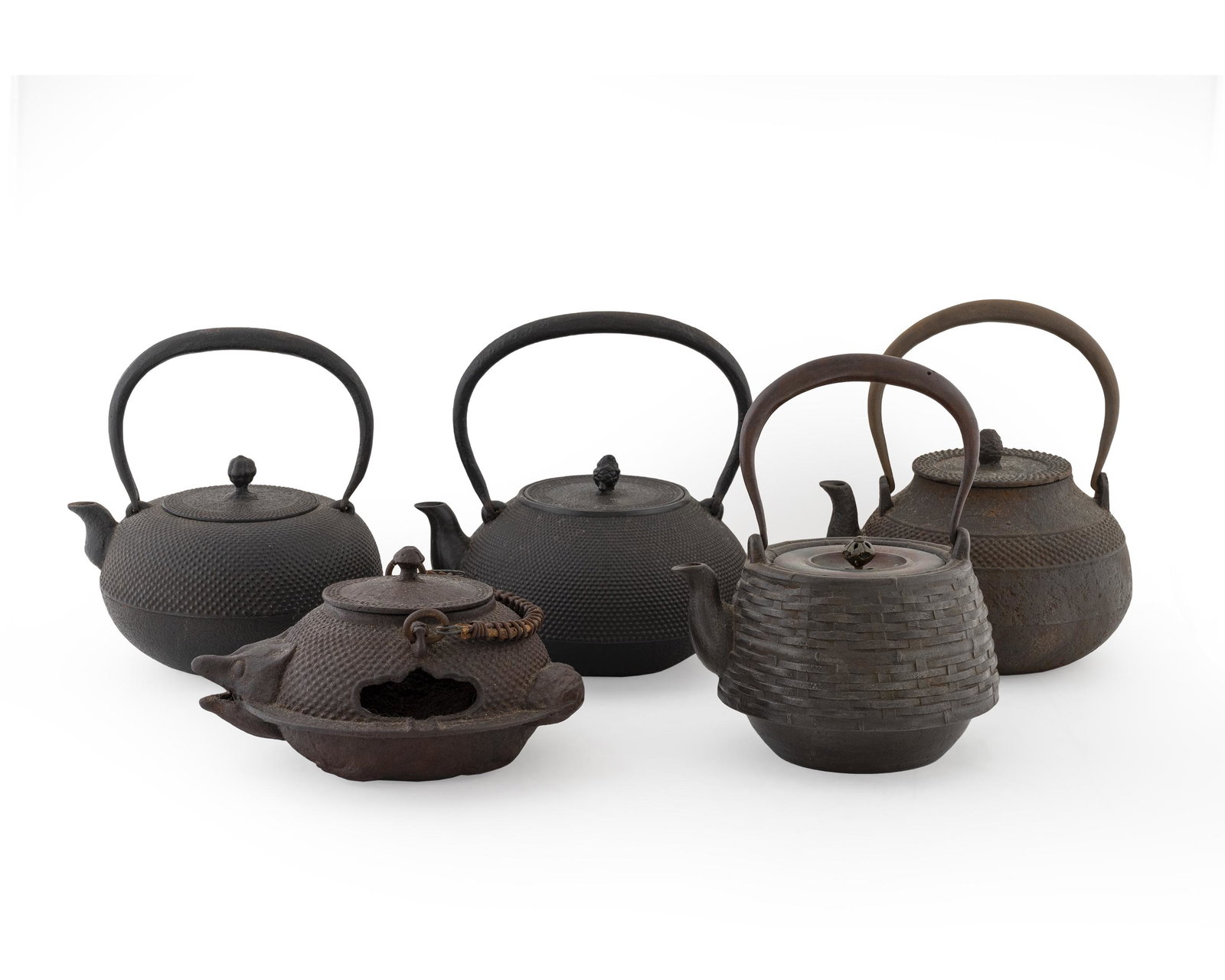 Five Japanese Iron Teapots Height of largest 4 3/4: Five Japanese Iron Teapots 20TH CENTURY one signed. Height of largest 4 3/4 inches.