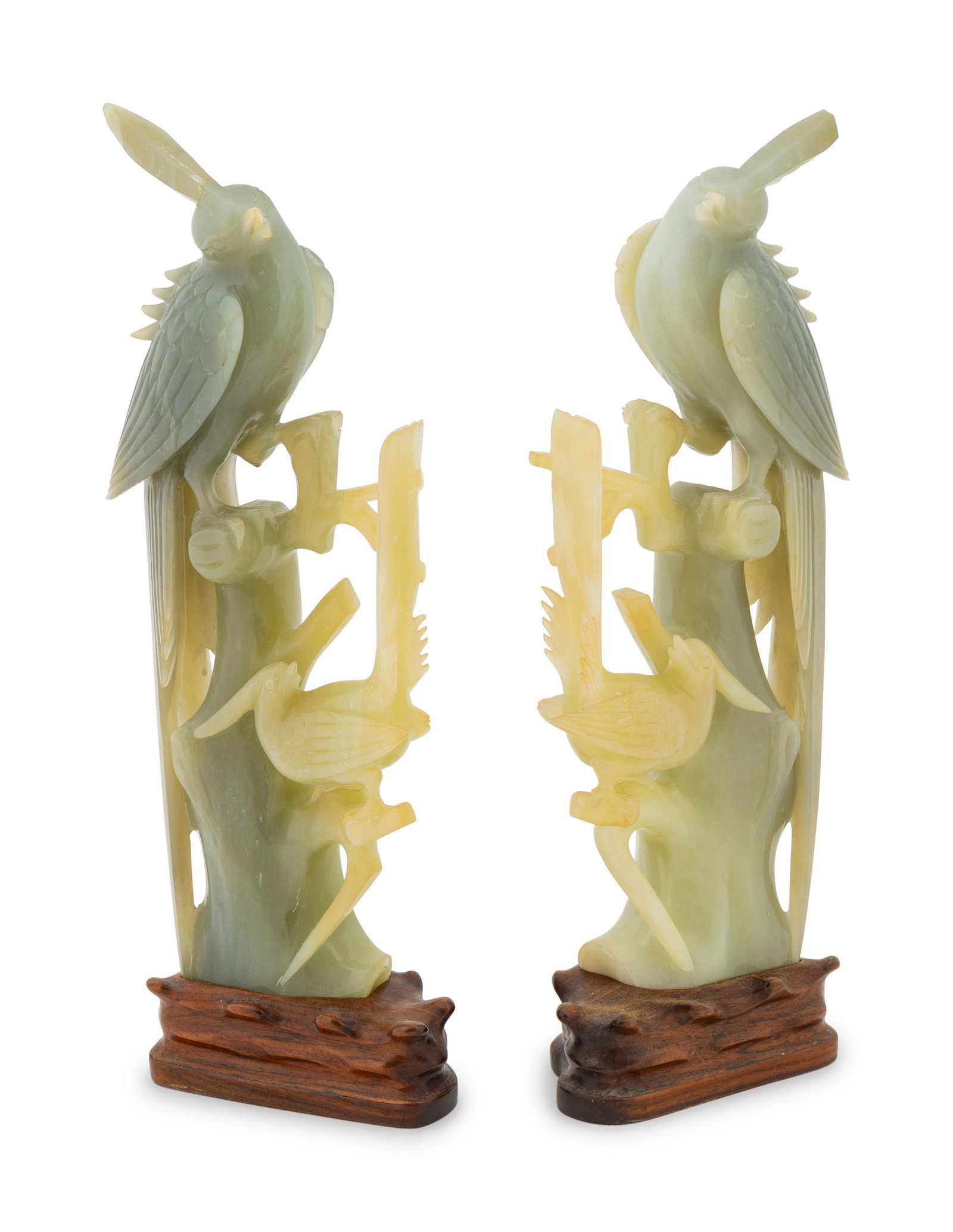 A Pair of Chinese Jadeite Birds Perched on Branches: A Pair of Chinese Jadeite Birds Perched on Branches Height 14 inches.