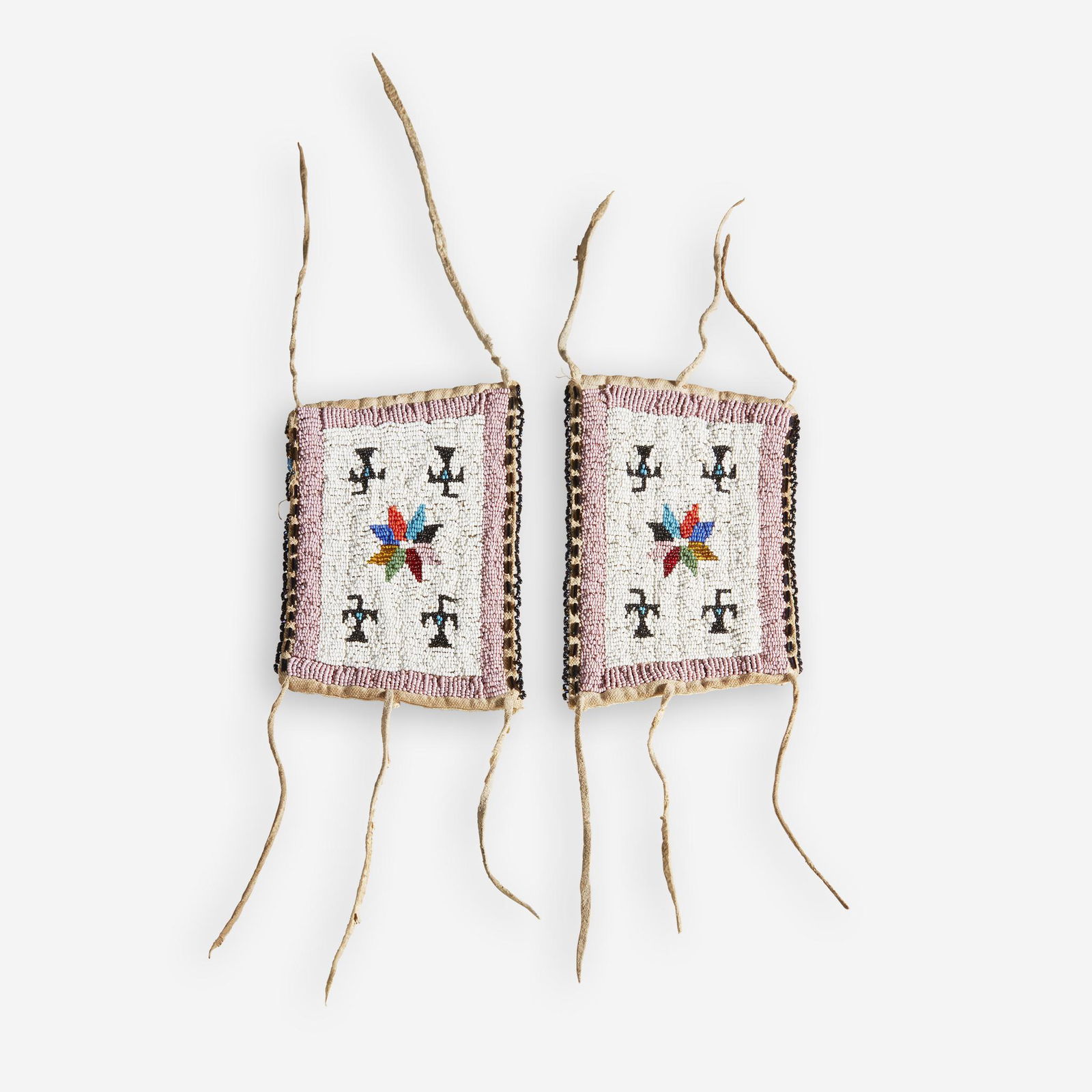 A pair of Plains beaded hide pictorial wrist bands, (1 of 1)