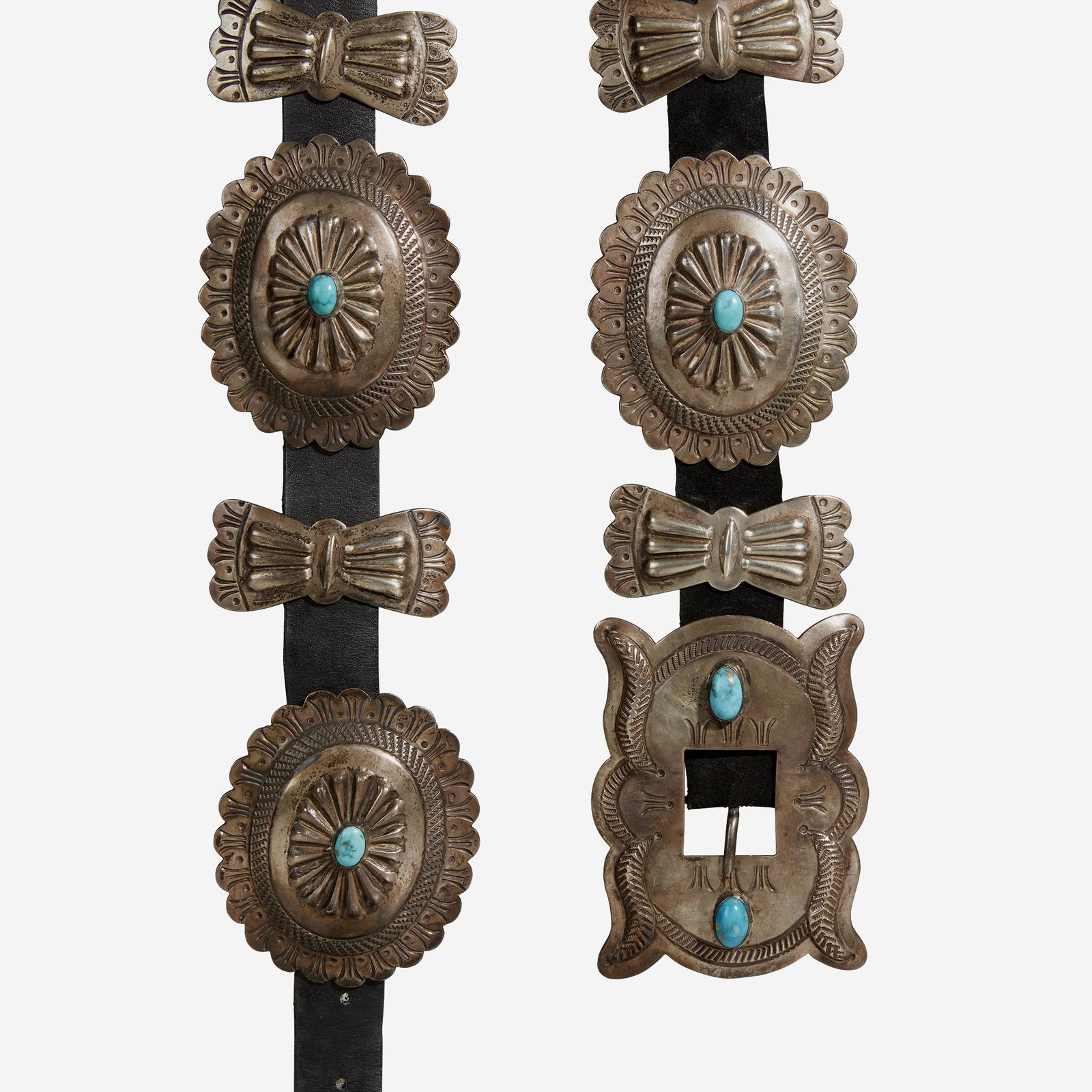 A silver and turquoise concho and butterfly belt, Early: A silver and turquoise concho and butterfly belt Early 20th century On a black suede belt.L: 48 in. (belt)PROVENANCE:A Private Family Collection.