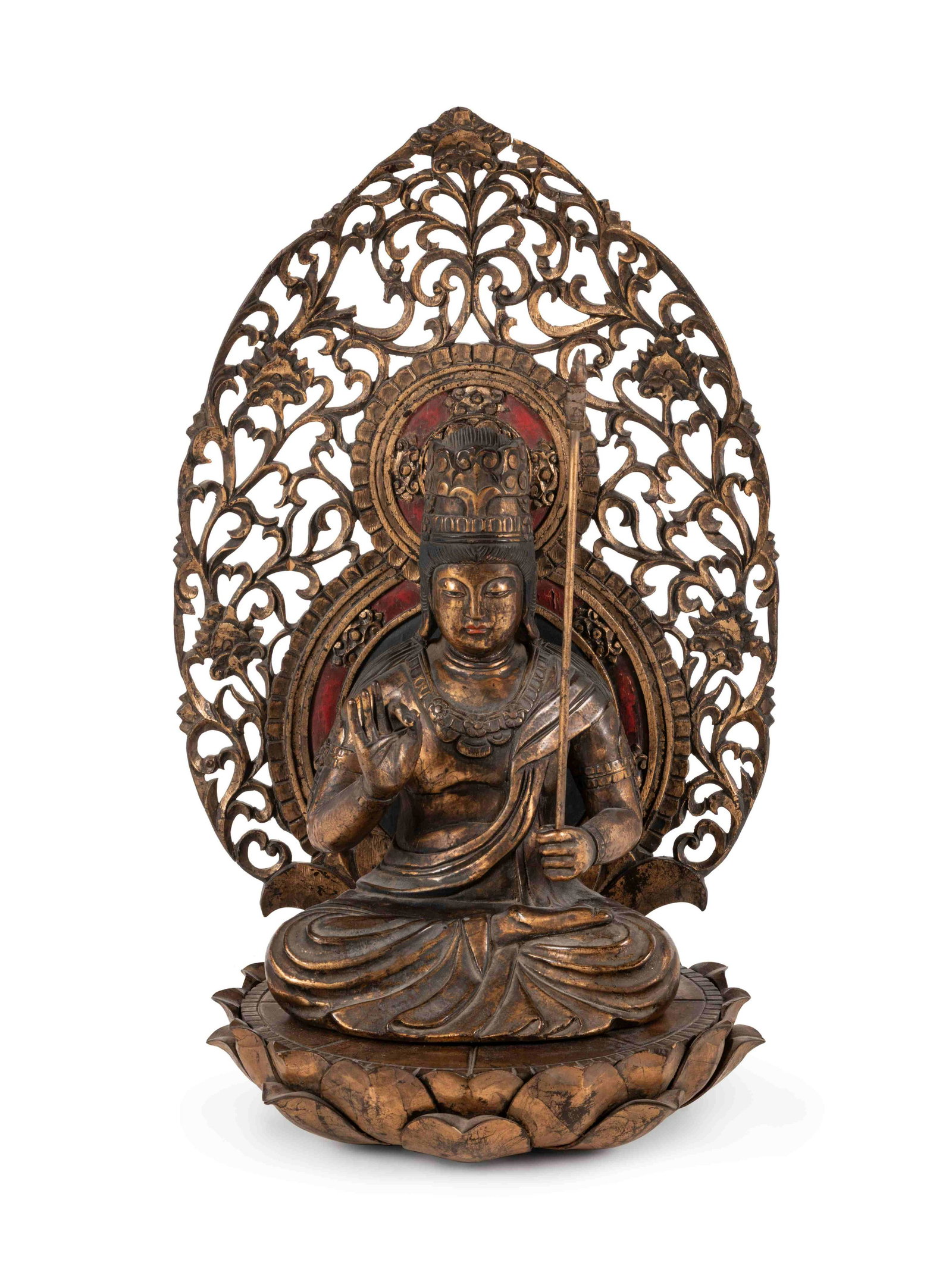 A Large Gilt Wood Figure of Kannon: A Large Gilt Wood Figure of Kannon the deity depicted seated on a lotus base, dressed in voluminous robes, wearing elaborate jewelry and a crown, backed by a mandala decorated with openworked lotus sc