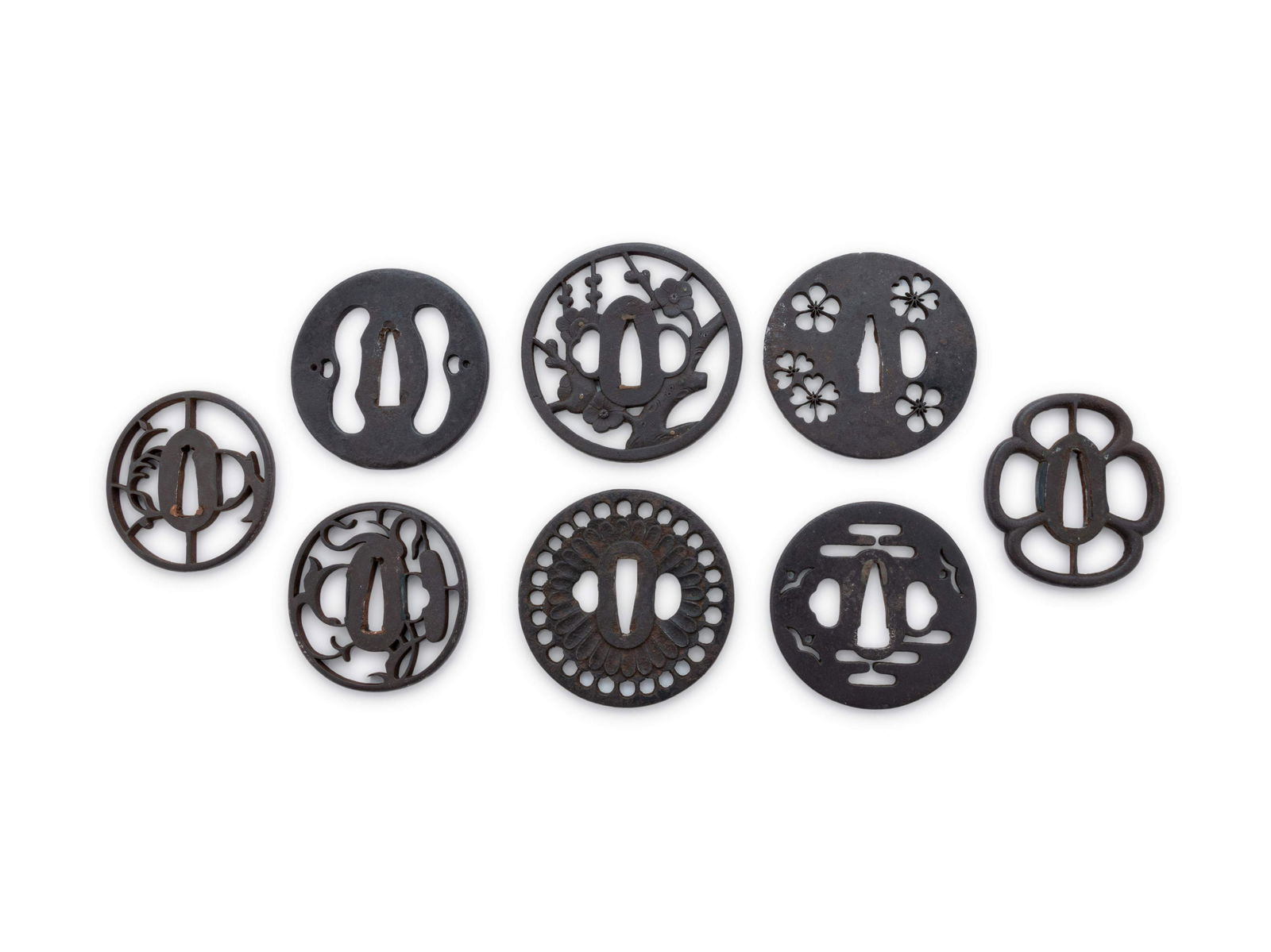 Ten Cast Iron Tsubas: Ten Cast Iron Tsubas of various form, each with openworked decoration, unsigned. Diameter of largest 3 3/8 in., 8.4 cm. Property from the Estate of WM Bogdanowicz, Madison, Wisconsin and Naples, Flori