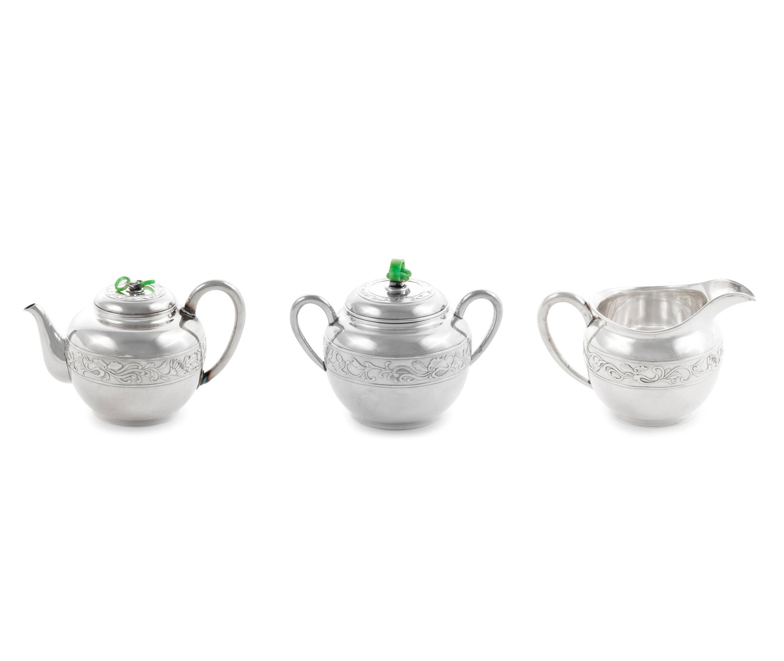 A Japanese Export Silver Three-Piece Tea Service: A Japanese Export Silver Three-Piece Tea Service comprising a teapot and cover, a sugar bowl and a creamer; marked on undersides. Height of teapot 4 7/8 in., 12.4 cm. Gross weight (3) 31 ozt 1 dwt (97