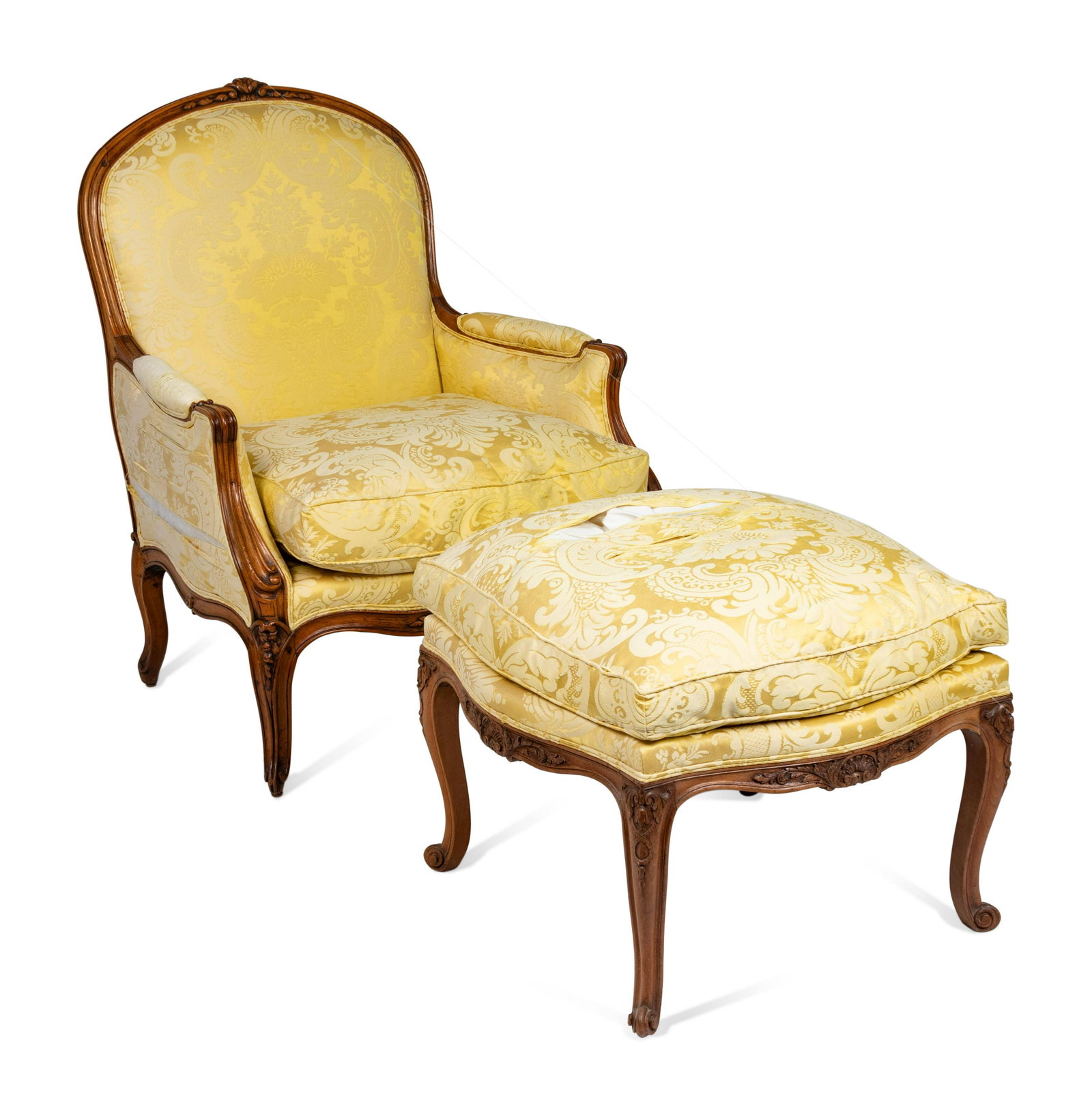 A Louis XV Style Carved Beechwood Bergere and Ottoman: A Louis XV Style Carved Beechwood Bergere and Ottoman 20th Century Height of bergere 41 x width 31 1/4 x depth 29 inches. Property from the Estate of Sally Gatling Tomlinson, Atlanta, Georgia