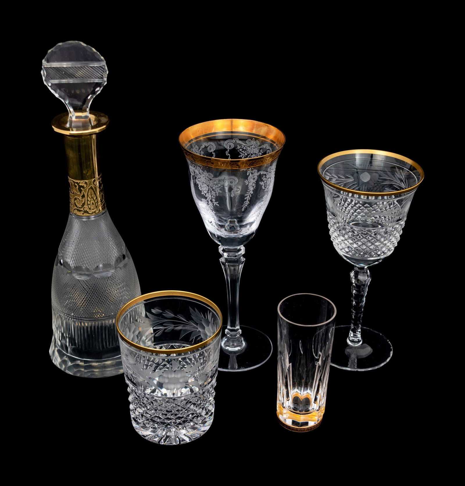 An Etched Glass Part Stemware Service Height of: An Etched Glass Part Stemware Service 20th Century 21 items including wine glasses, cordials, two tumblers, and a decanter Height of decanter with stopper 12 inches. Property from the Estate of Sally 