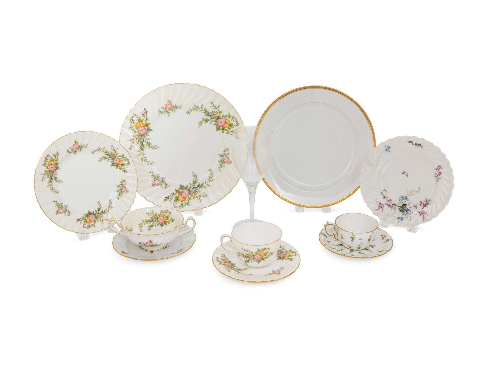 A Group of Porcelain Dinner Services Diameter of dinner: A Group of Porcelain Dinner Services including Havilland, Royal Crown Derby, Minton and York, and wine glasses (114 pieces) Diameter of dinner plate 10 3/4 inches. Property from the Estate of Sally Ga
