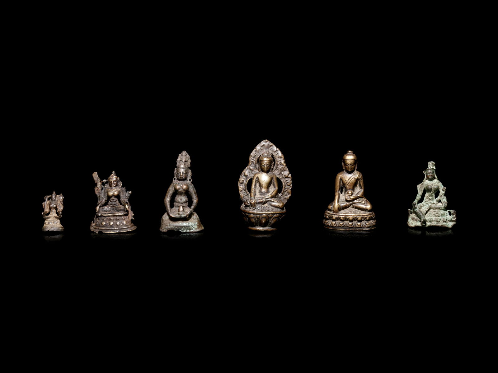 Six Small Tibetan and Southeast Asian Bronze Figures of (1 of 3)