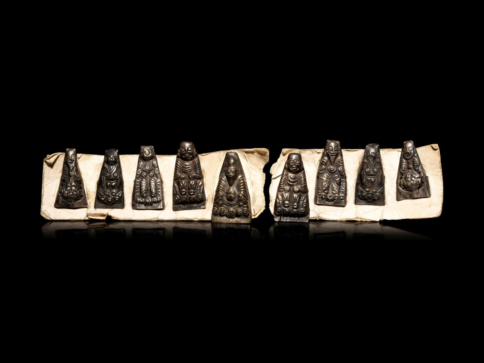 Nine Small Southeast Asian Silver Buddhist Votives (1 of 4)