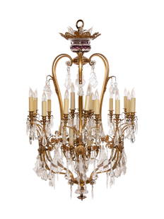 A Continental Gilt Metal and Glass Thirty-Six-Light: A Continental Gilt Metal and Glass Thirty-Six-Light Chandelier Early 20th Century Height 61 x diameter 34 inches. Property from the Chicago North Shore home designed by Benjamin Marshall for Axel Lonn