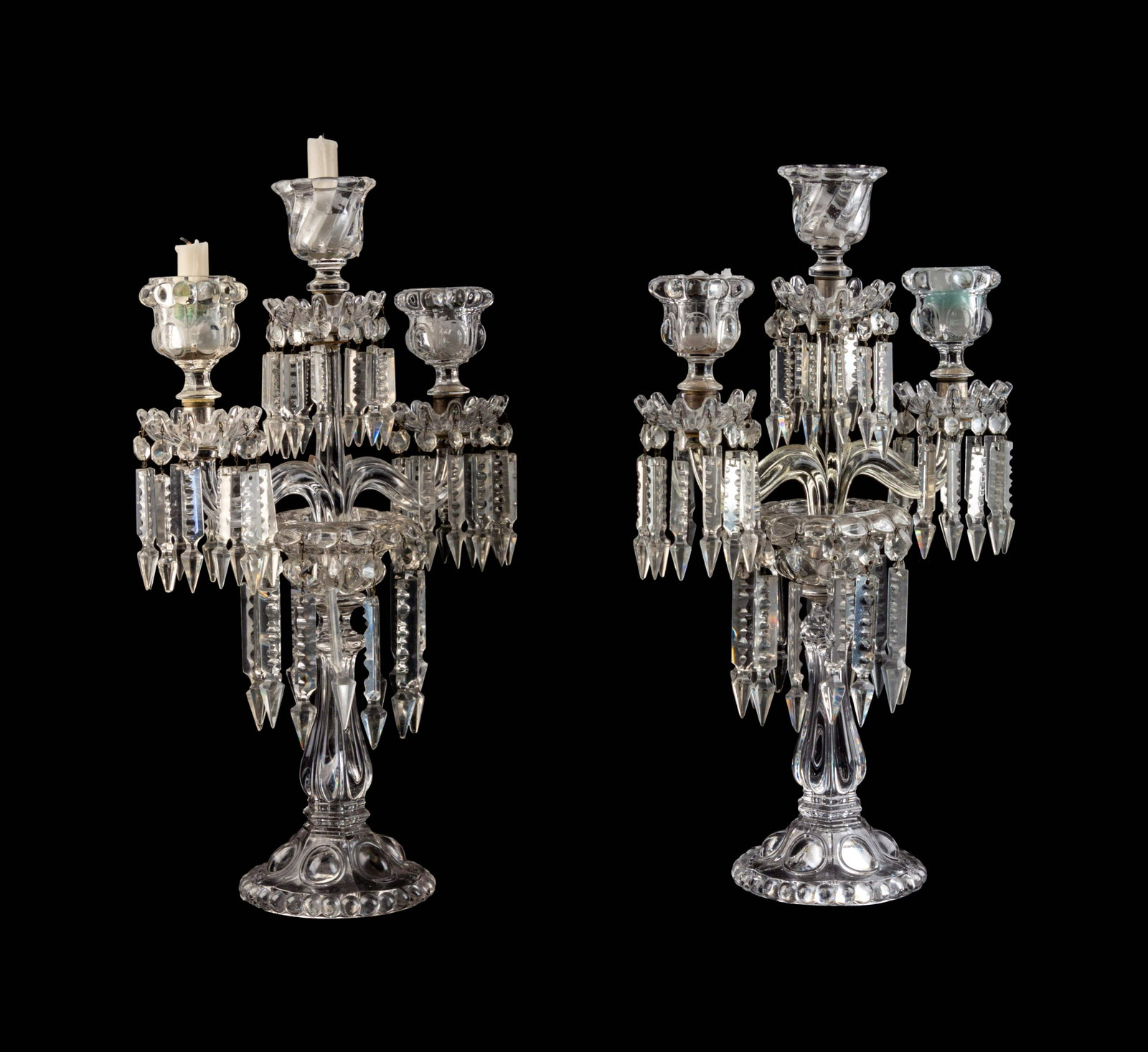 A Pair of Baccarat Molded Glass Three-Light Candelabra: A Pair of Baccarat Molded Glass Three-Light Candelabra 20th Century Height 21 inches. Property from the Estate of Dorothy Manewal Stephens, St. Louis, Missouri