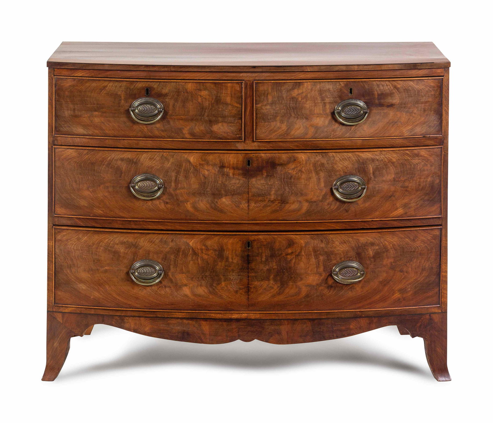 A George III Mahogany and Walnut Chest of Drawers: A George III Mahogany and Walnut Chest of Drawers Late 18th Century Height 33 x width 40 3/4 x depth 18 1/2 inches. Property from the Estate of Joan Conway Crancer, St. Louis, Missouri