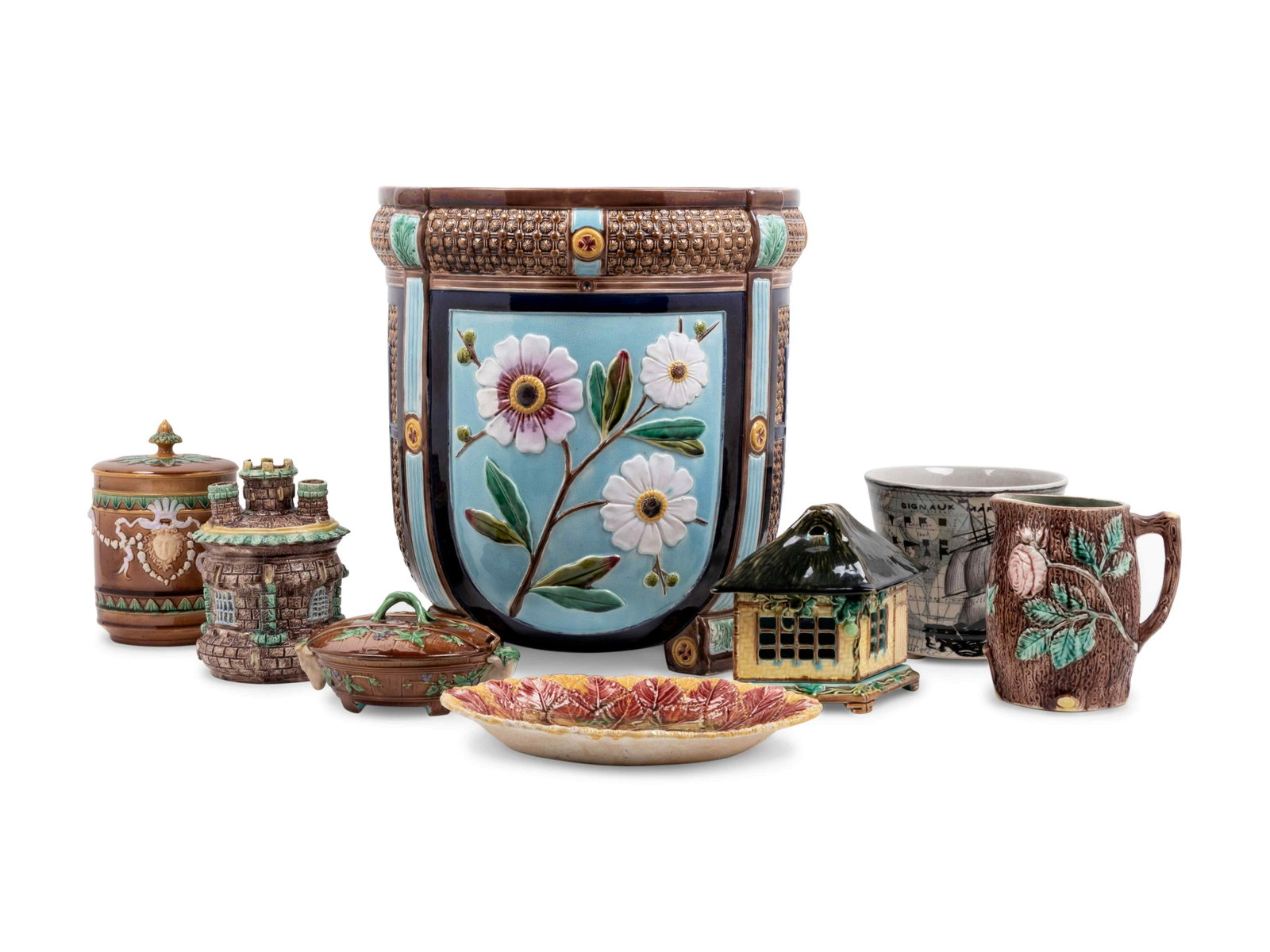 Seven English Majolica Articles: Seven English Majolica Articles 19th Century and Later together with another vase. Height of biscuit jar 7 3/4 inches. Property from a Robert Metzger-designed interior, Maryland