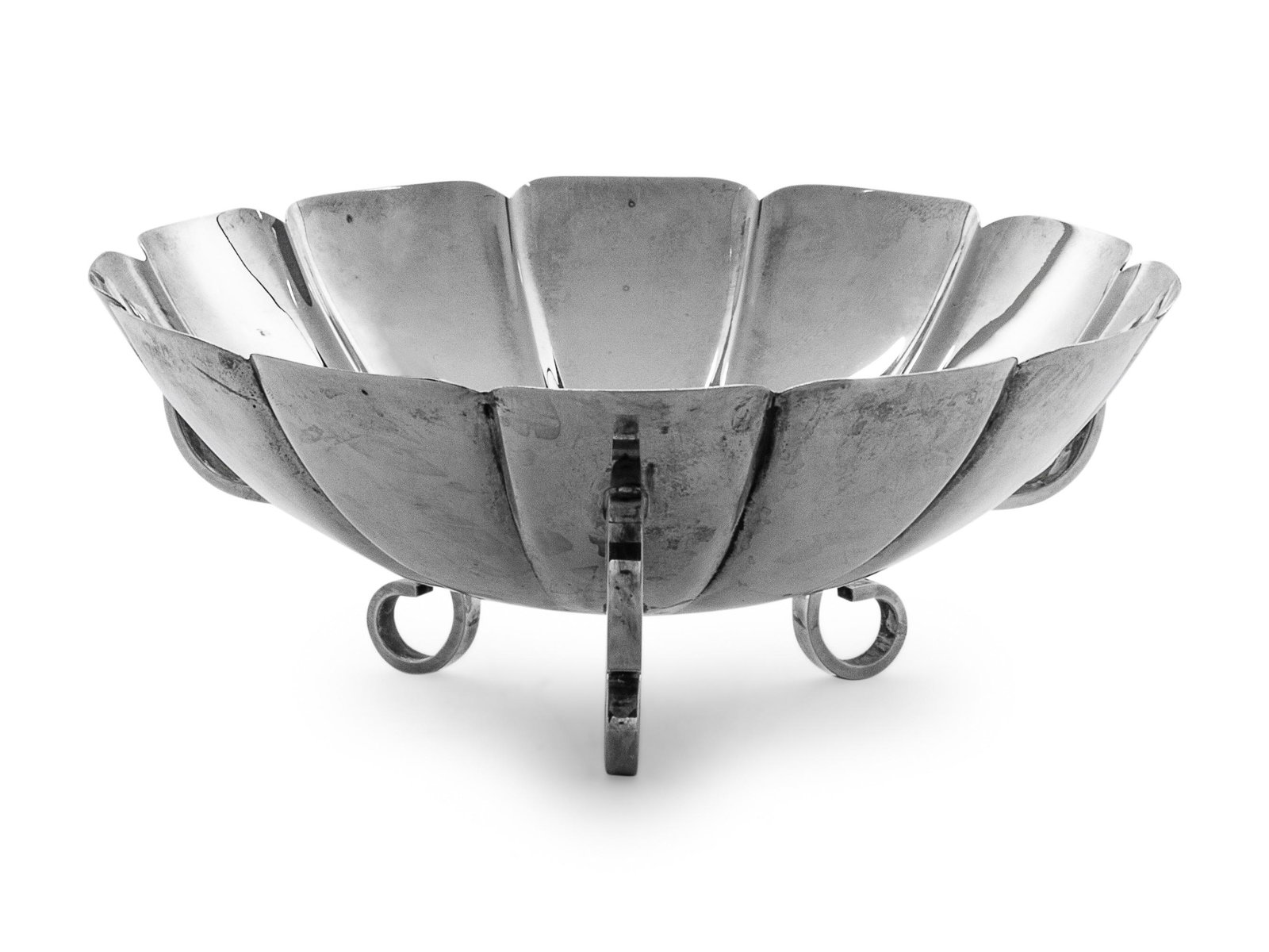 An American Silver Candy Bowl: An American Silver Candy Bowl Webster Co., North Attleboro, MA, 20th Century, retailed by Cartier raised on volute feet. marked 'Sterling' on underside 5 ozt Diameter 6 inches. 