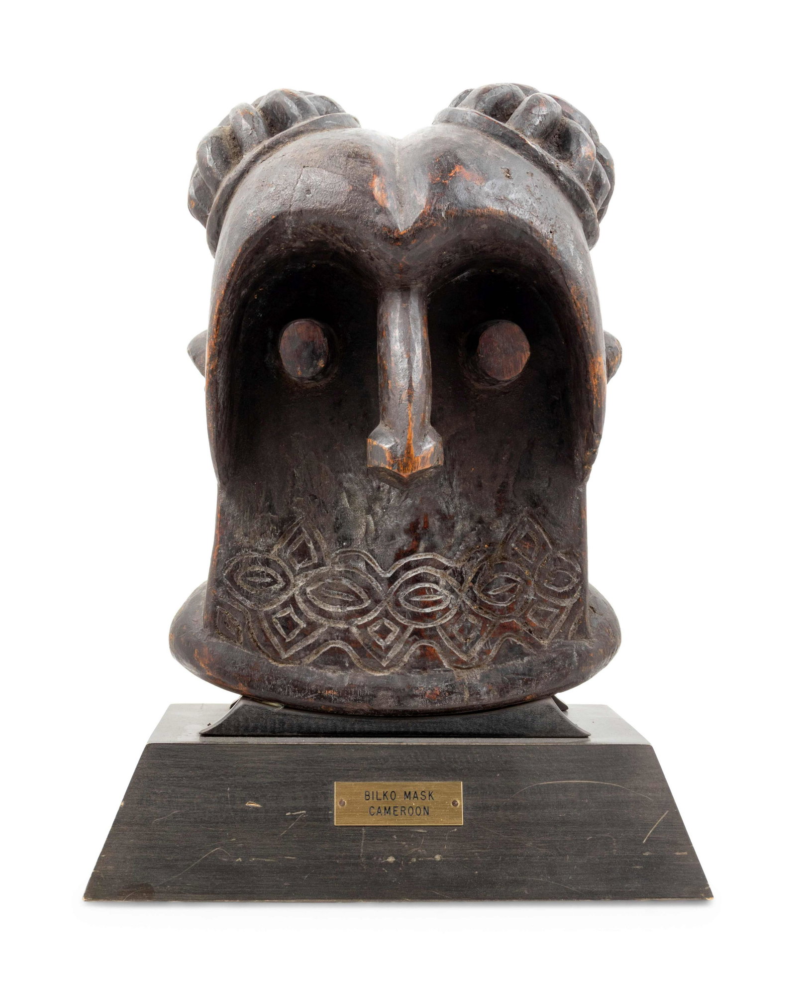 A Bamileke Carved Wood Helmet Mask: A Bamileke Carved Wood Helmet Mask Cameroon, Mid-20th Century Height 16 x width 11 x depth 8 1/2 inches. Property from the Johnson Publishing Company, Chicago, Illinois
