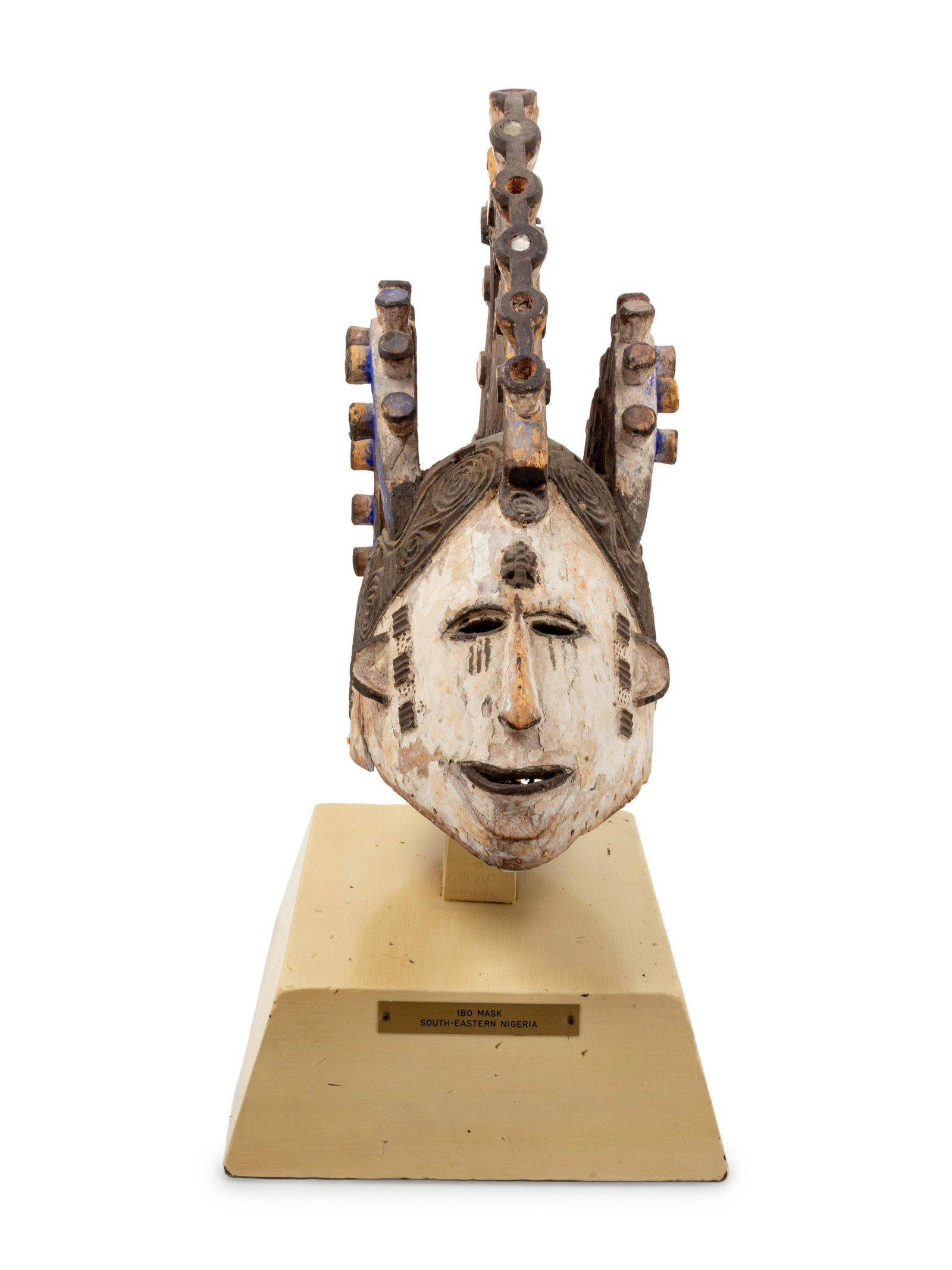 An Igbo Painted Wood Mask: An Igbo Painted Wood Mask Nigeria, Mid-20th Century Height 16 1/2 x width 6 x depth 17 inches. Property from the Johnson Publishing Company, Chicago, Illinois