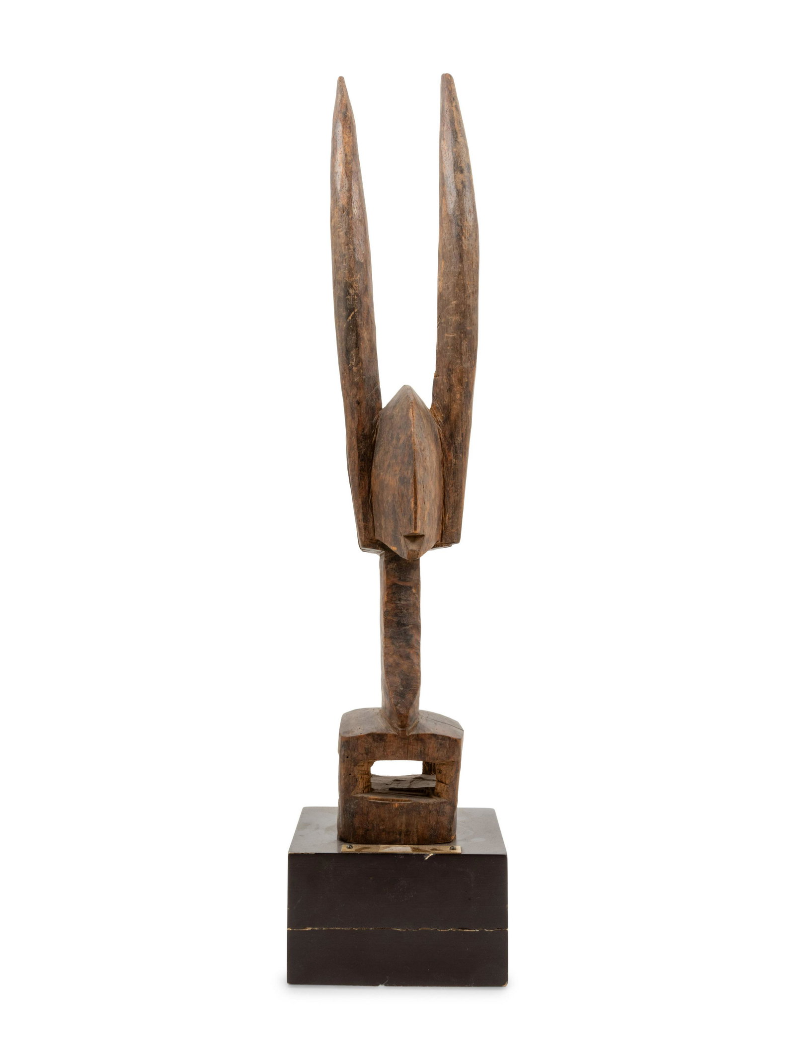 A Bambara Carved Wood Antelope Sculpture: A Bambara Carved Wood Antelope Sculpture Mali, Mid-20th Century Height 19 1/2 x width 3 1/2 x depth 3 inches. Property from the Johnson Publishing Company, Chicago, Illinois