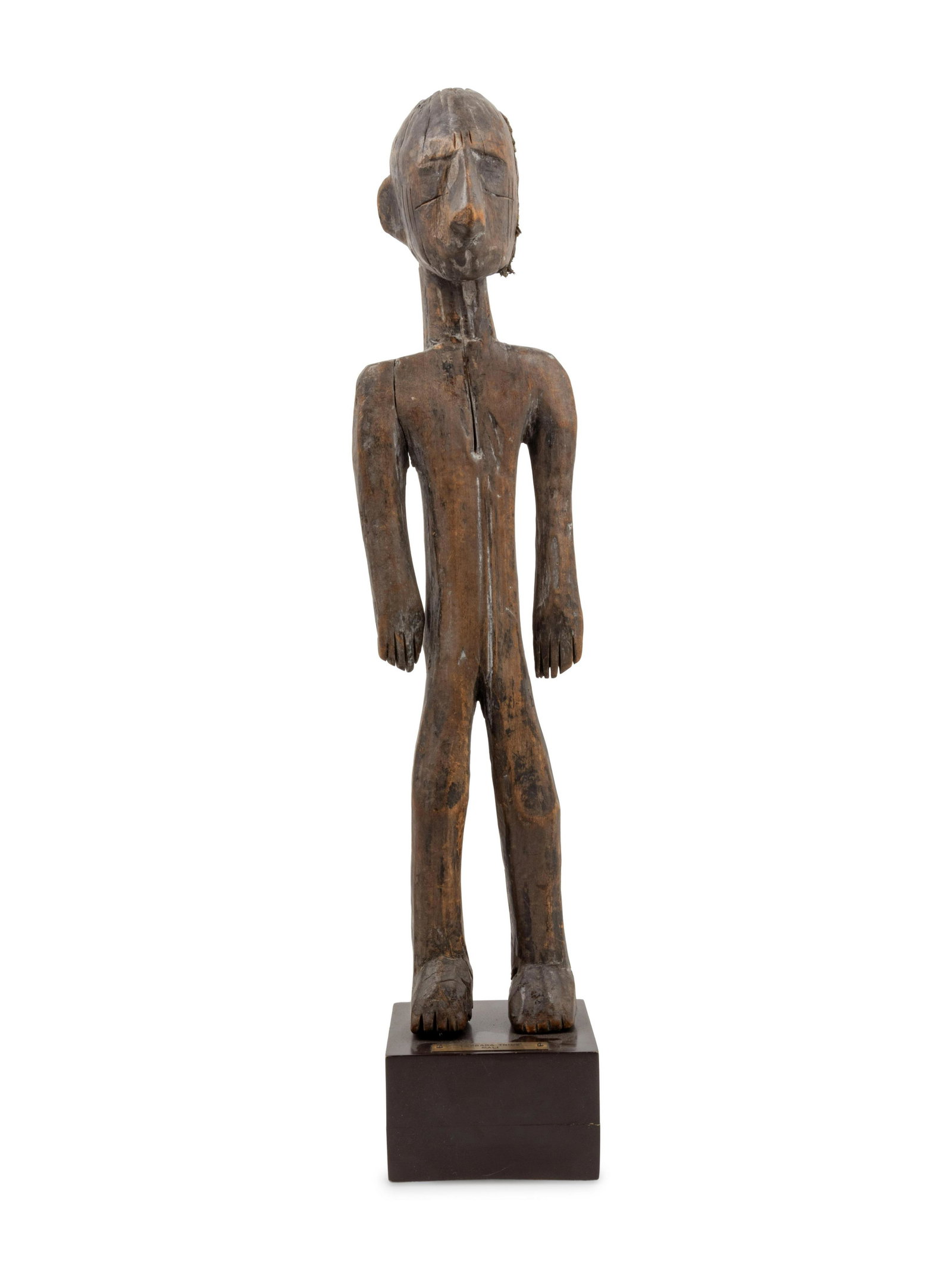 A Bambara Carved Wood Figure: A Bambara Carved Wood Figure Mali, Mid-20th Century Height 22 1/2 x width 5 1/2 x depth 4 1/2 inches. Property from the Johnson Publishing Company, Chicago, Illinois