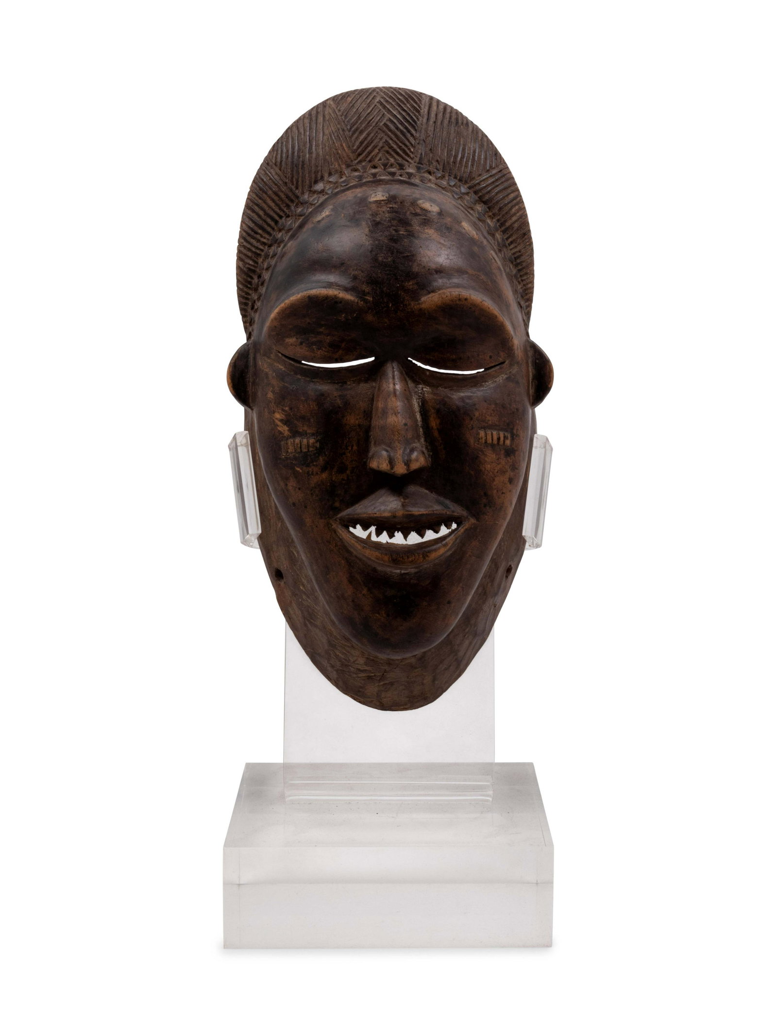 A Baule Style Carved Wood Mask: A Baule Style Carved Wood Mask Mid-20th Century Height 12 x width 6 x depth 4 inches. Property from the Johnson Publishing Company, Chicago, Illinois