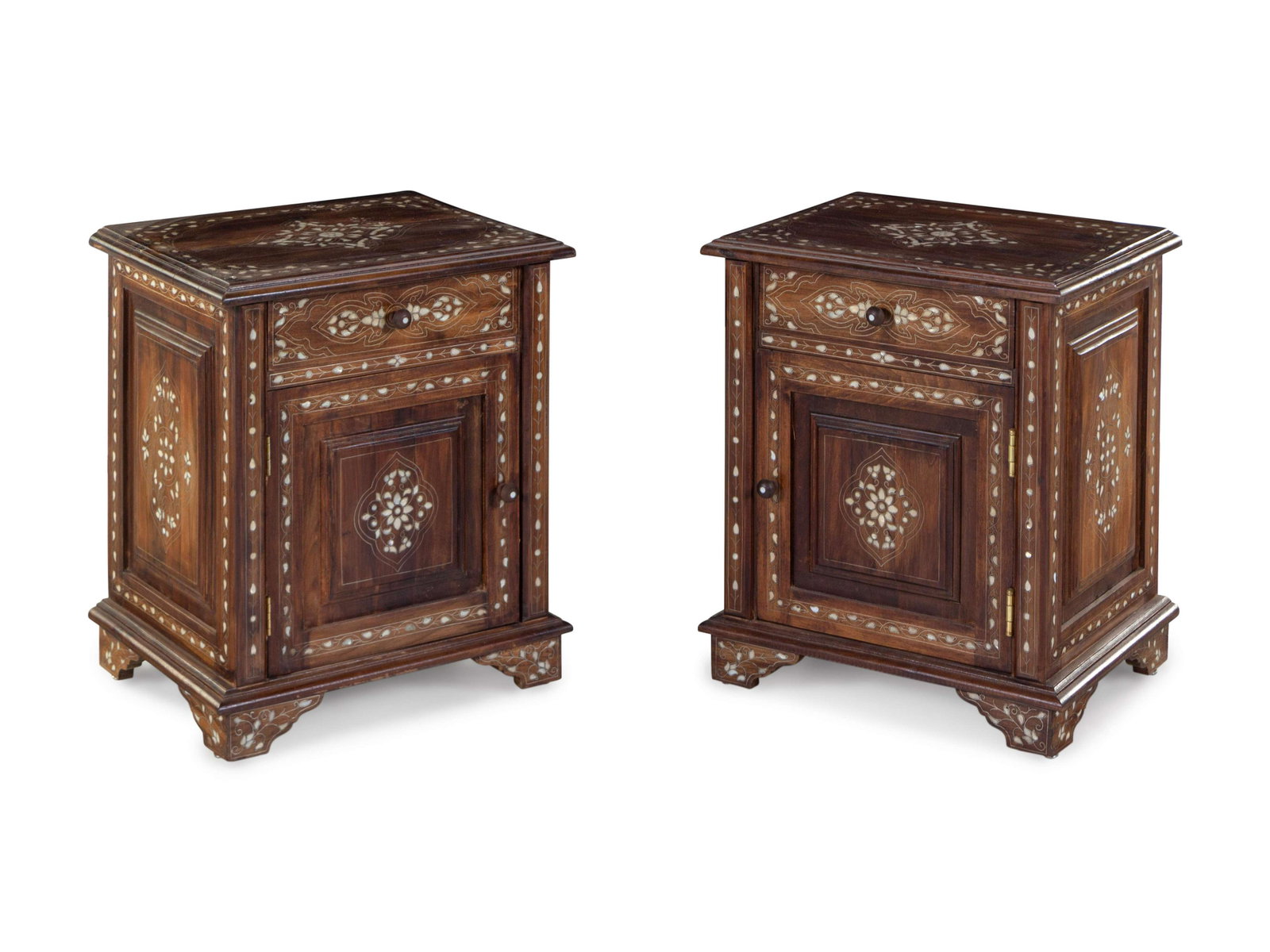 A Pair of Syrian Mother-of-Pearl Carved and Inlaid: A Pair of Syrian Mother-of-Pearl Carved and Inlaid Walnut Night Stands 20th Century Height 25 1/2 x width 21 1/2 x depth 17 inches. Property sold to benefit Karam Foundation, providing education, aid 
