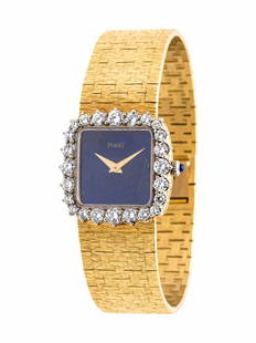 PIAGET, 18K YELLOW GOLD, LAPIS LAZULI AND DIAMOND: PIAGET, 18K YELLOW GOLD, LAPIS LAZULI AND DIAMOND WRISTWATCH 23.00 x 23.00 mm case dimensions, the bezel containing 24 round brilliant cut diamonds, lapis lazuli dial, manual wind movement,