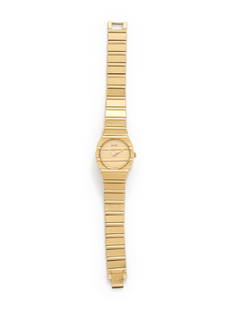 PIAGET, 18K YELLOW GOLD 'POLO' WRISTWATCH: PIAGET, 18K YELLOW GOLD 'POLO' WRISTWATCH 23.00 mm case diameter, matte and polished gold dial, applied gold dot numerals, quartz movement, integrated polished and matte gold bracelet, fold over