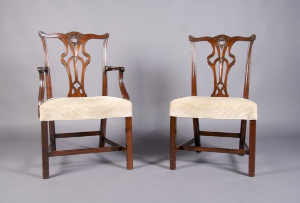 A Set of Eight English Mahogany Chairs, Height 38: A Set of Eight English Mahogany Chairs, in the style of Thomas Chippendale, comprising two armchairs and six side chairs, each with pierced splat over upholstered seat. Height 38 3/8 inches.