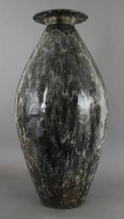 A French Ceramic Vase, Fernand Rumebe (1875-1952): A French Ceramic Vase, Fernand Rumebe (1875-1952), of elongated ovoid form with inverted lip and open bottom, having an allover drip glaze, signed F. Rumebe, numbered 52.k5. Height 30 inches.